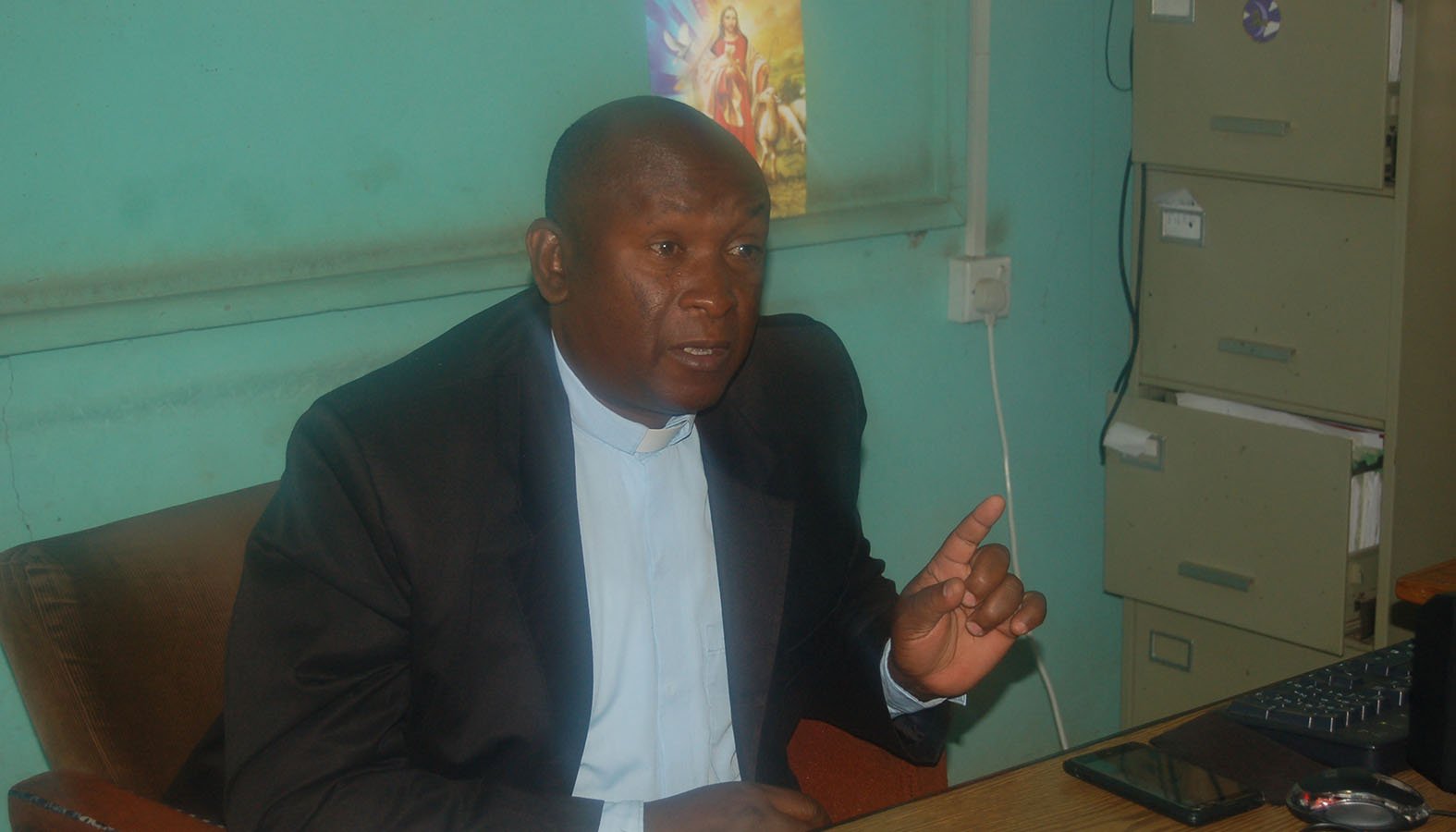 Father Gerald Matolo once worked at the same parish with Father Michael Maingi Kyengo, who was found murdered Oct. 16. Father Matolo, shown in this 2017 file photo, said his friend may have been targeted by people who thought he had money. (CNS photo/Fredrick Nzwili)