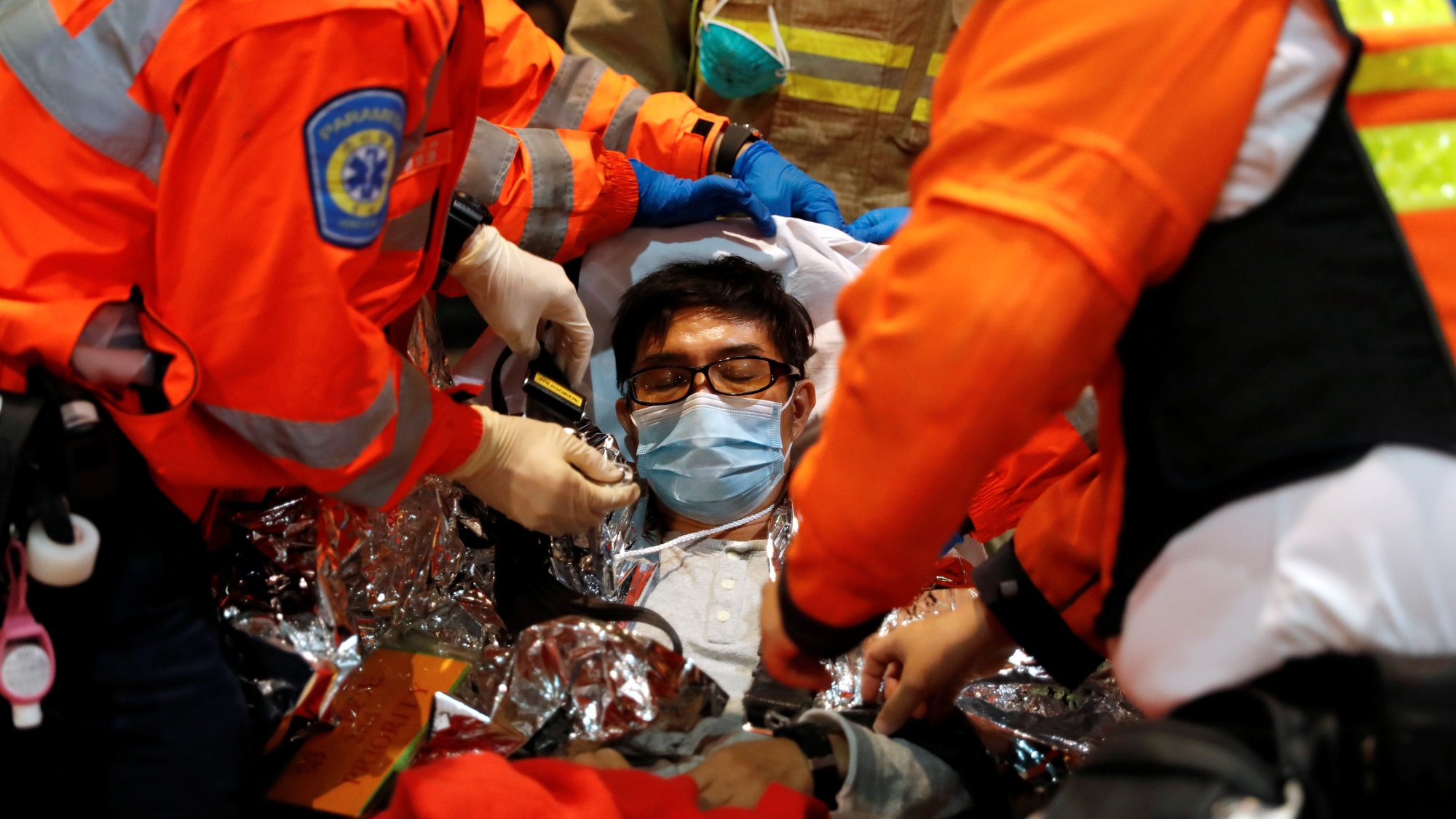 A protester receives medical attention Nov.19, 2019, at Hong Kong Polytechnic University campus during ongoing protests. Hong Kong religious leaders, including Cardinal John Tong Hon, called for an end to violence on both sides and offered to mediate. (CNS photo/Adnan Abidi, Reuters)