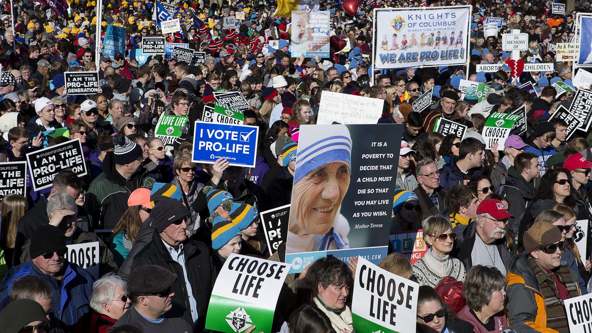 People gather during the annual March for Life rally in Washington Jan. 19, 2018. Archbishop Joseph F. Naumann of Kansas City, Kan., chairman of the U.S. bishops' Committee for Pro-Life Activities, and 17 other pro-life leaders have called on President Donald Trump to block an amendment they say would "enrich global abortion providers," which currently is part of a Senate appropriations measure. (CNS photo/Tyler Orsburn)