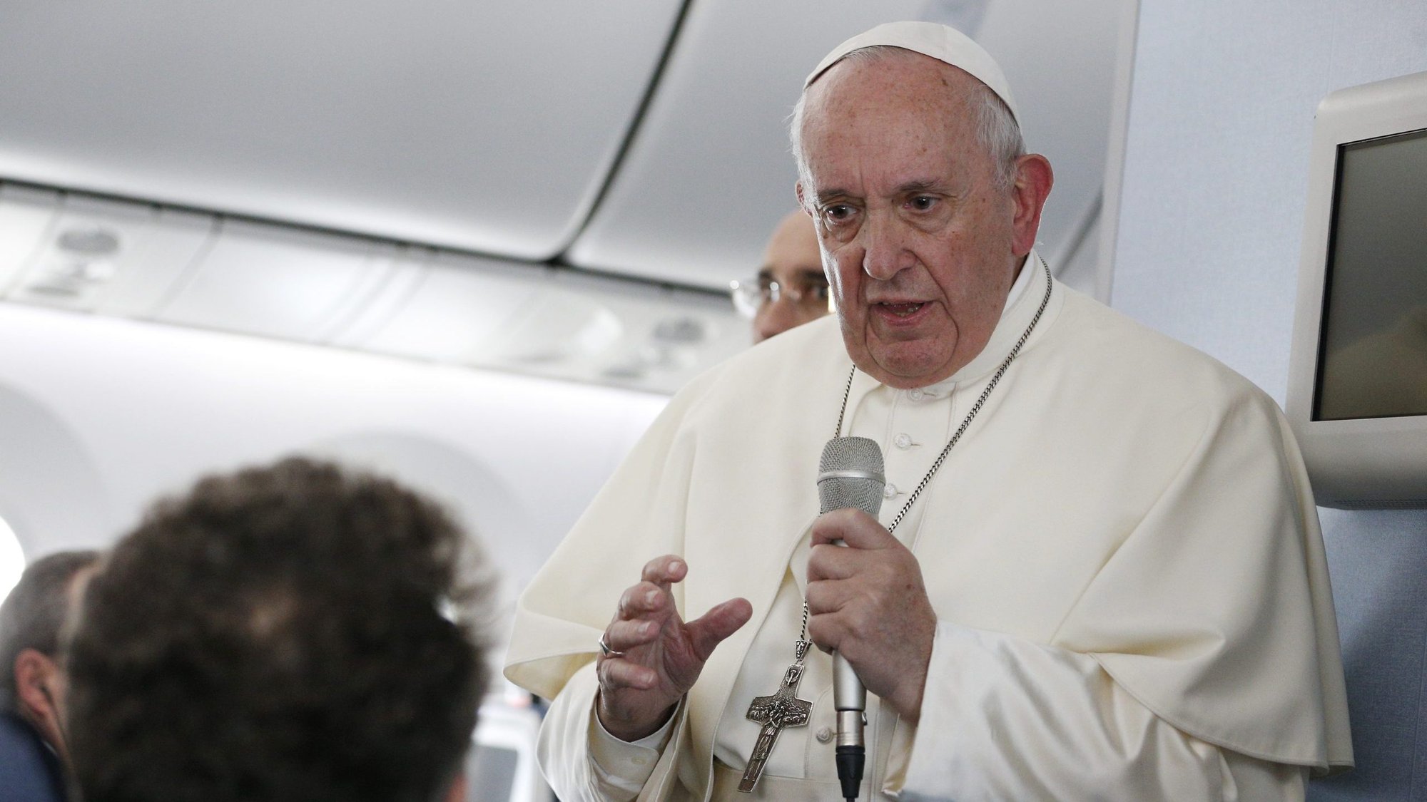Pope Francis answers questions from reporters aboard his flight from Tokyo to Rome Nov. 26, 2019. (CNS photo/Paul Haring)