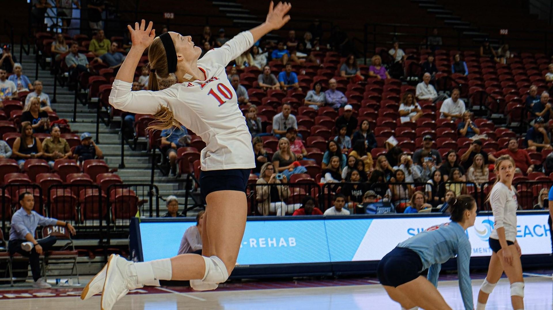 LMU’s Megan Rice prepares to slam a service ace in a recent match. The Lions play twice at home this week. (LMU Athletics)