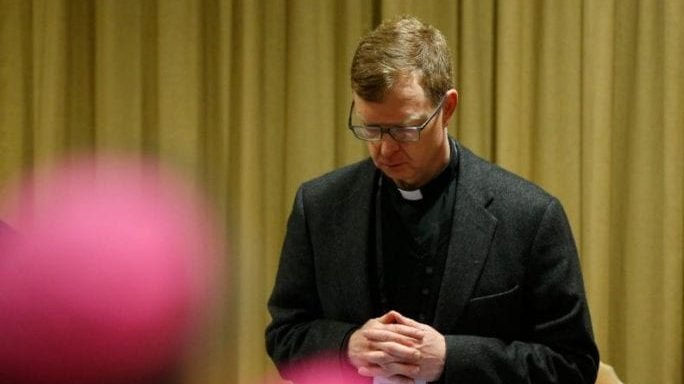 Jesuit Father Hans Zollner, president of the Centre for Child Protection at the Pontifical Gregorian University in Rome, prays at the start of the third day of the meeting on the protection of minors in the Church at the Vatican Feb. 23, 2019. (Paul Haring/CNS via Crux)