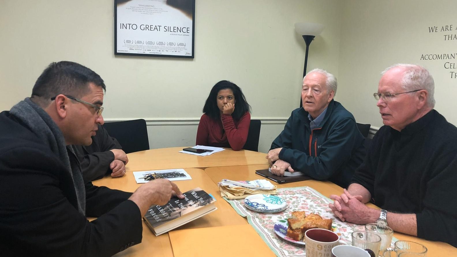 Salvadoran Bishop Oswaldo Escobar Aguilar talks to Jesuit Father Kevin Gillespie, right, pastor of Holy Trinity Catholic Church and parish members in Washington's Georgetown section Nov. 8, 2019. The prelate from the Diocese of Chalatenango in northern El Salvador spoke about various social justice topics but also the Salvadoran church's quest for justice. (CNS photo/Rhina Guidos)