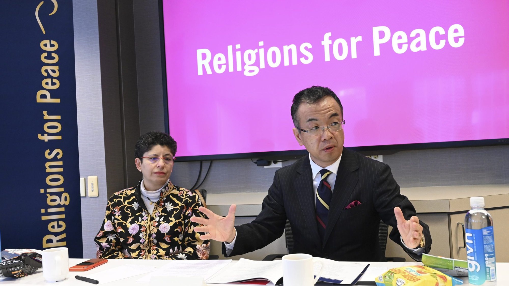 Azza Karam, secretary-general-elect of Religions for Peace, and the Rev. Kyoichi Sugino, acting secretary-general, speak to the audience Dec. 11, 2019, during the Religions for Peace gathering Dec. 11 to 13 in New York City. Religions for Peace is a coalition that represents millions of believers around the world. (CNS photo/Vatican Media)