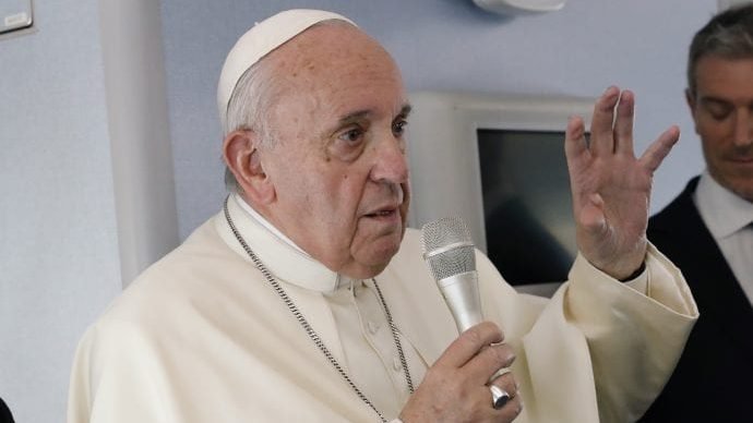Pope Francis speaks during a news conference on board the papal plane on his flight back from a trip to Thailand and Japan, Monday, Nov. 26, 2019. (Remo Casilli/AP Pool Photo via Crux)