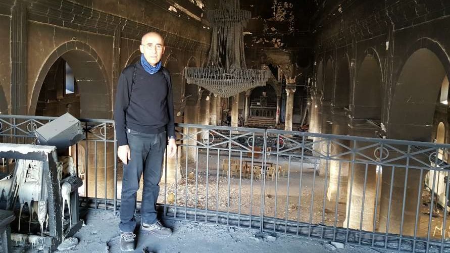Fr. Georges Jahola in Al-Tahira church in Bakhdida in November 2016, shortly after the town's liberation. (Courtesy of Fr. Jahola via CNA)