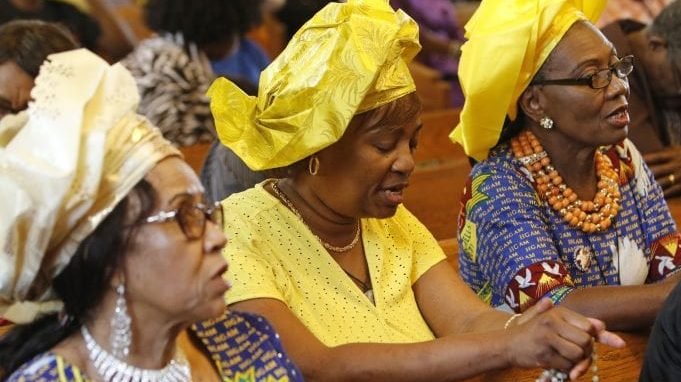 Women recite the rosary prior to a Mass for Catholics of Nigerian descent July 21, 2019, at St. Thomas the Apostle Chapel in West Hempstead, N.Y. The liturgy capped a four-day revival/retreat that provided an opportunity to more than 600 participants from the New York metropolitan area and beyond to renew their spiritual lives while celebrating their faith, culture and ancestry. (CNS photo/Gregory A. Shemitz via Crux)