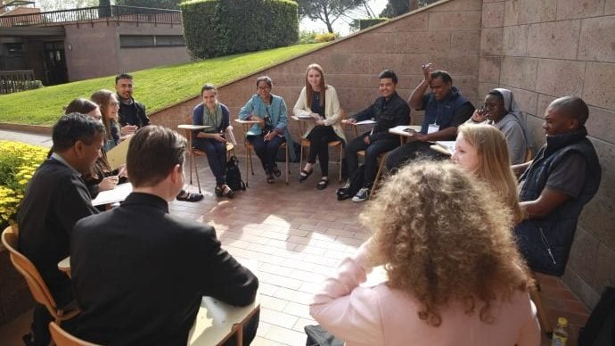 Young people talk during a conference in Rome April 6. The conference was in preparation for next year's Synod of Bishops on young people, the faith and vocational discernment and World Youth Day in 2019. (CNS via Crux)