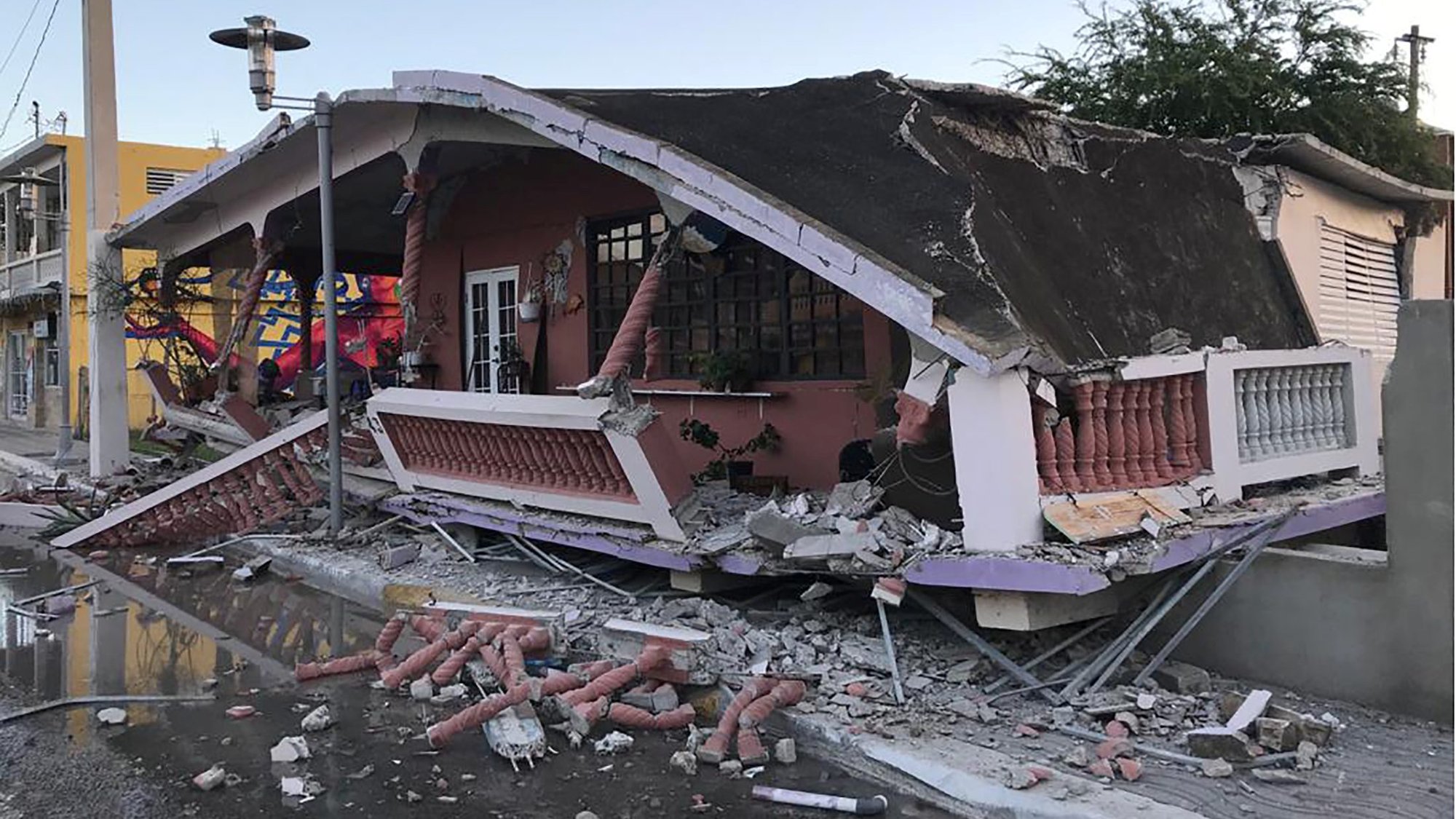 A destroyed home is seen after an earthquake in Guanica, Puerto Rico, Jan. 6, 2020. A larger temblor of magnitude 6.4 rattled Puerto Rico before dawn Jan. 7, killing at least one person and destroying a Catholic church. A series of earthquakes and aftershocks beneath the southern part of the island have been occurring since the night of Dec. 28-29. (CNS photo/Ricardo Ortiz, Reuters)