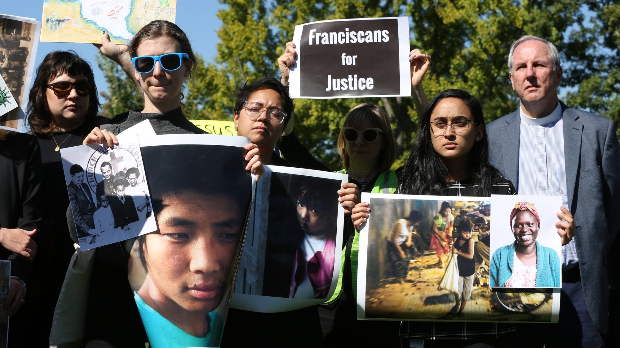 Activists hold signs during a protest Oct. 15, 2019, outside the U.S. Capitol in Washington against the Trump administration's cuts in the number of refugees to be admitted under the U.S. resettlement program. The Catholic and Lutheran bishops of Minnesota, in an open letter first published Dec. 23 in the Minneapolis Star Tribune, urged support and prayers for those seeking shelter and protection. (CNS photo/Bob Roller)