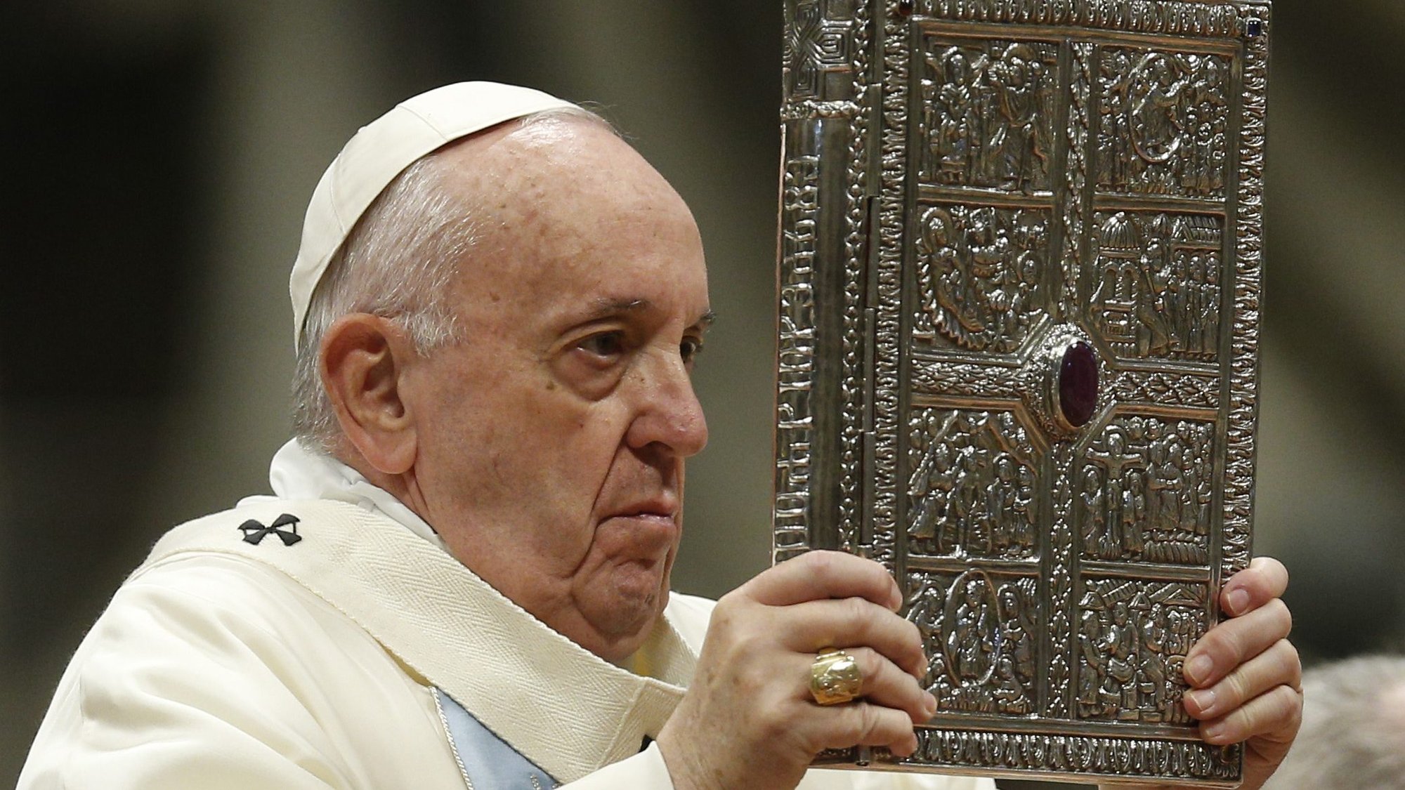 Pope Francis holds the Book of the Gospels as he celebrates Mass on the feast of Mary, Mother of God, in St. Peter's Basilica at the Vatican Jan. 1, 2020. The pope has established the third Sunday in Ordinary Time as "Sunday of the Word of God." It will be celebrated for the first time Jan. 26. (CNS photo/Paul Haring)
