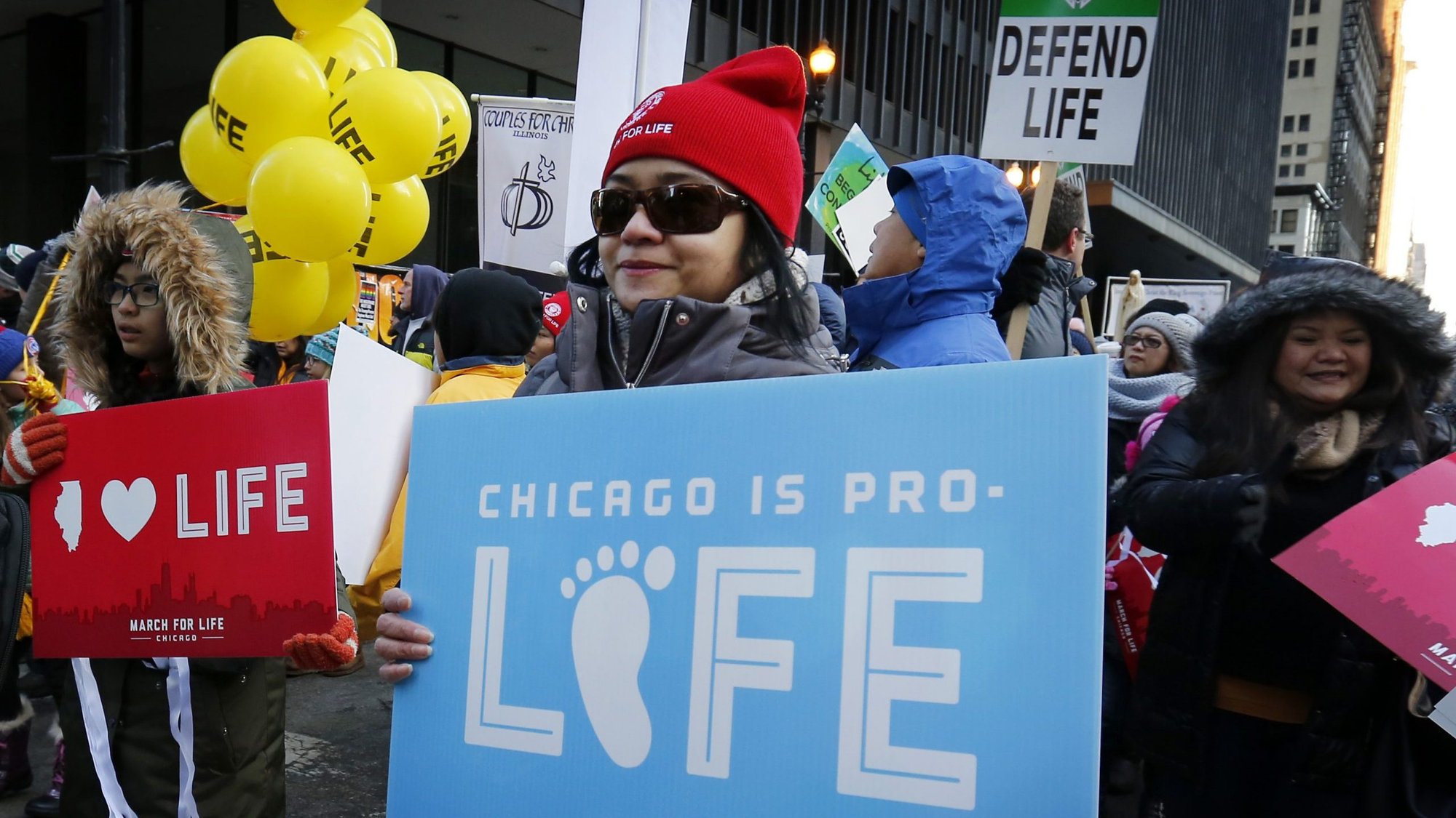 A woman carries a sign during the annual March for Life in Chicago Jan. 13, 2019. Participants in this year's March for Life, with the theme, "Life Empowers: Pro-Life is Pro-Woman," will kick off with a with a rally Jan. 11, 2020. As the annual event is attracting more people, organizers said this year's march will have many changes, starting with a new venue and a convention featuring pro-life ministries and other exhibitors. (CNS photo/Karen Callaway, Chicago Catholic)