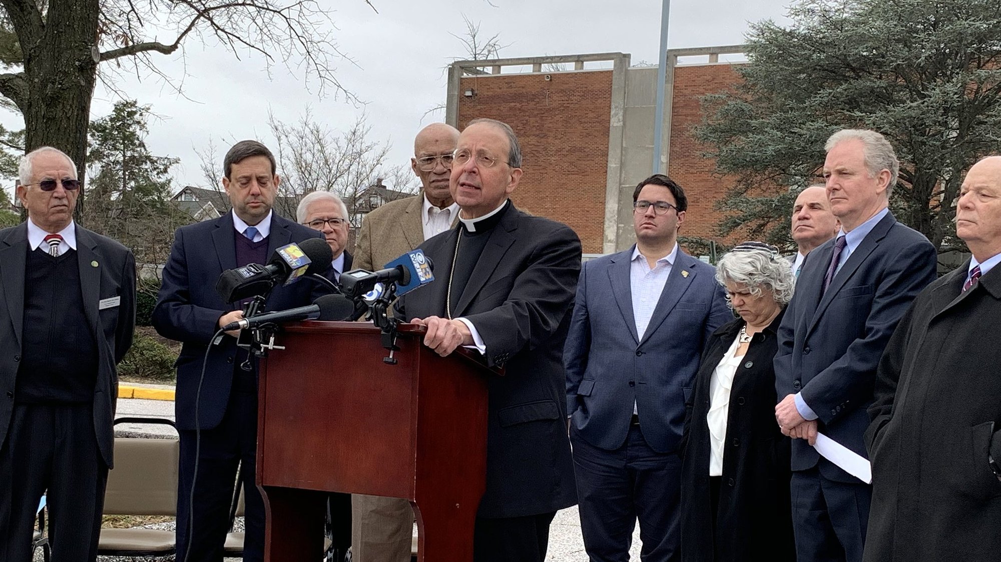 Baltimore Archbishop William E. Lori speaks in favor of increased federal funding for religious sites during a Jan. 13, 2020, news conference. The archbishop was joined by Rudwan Abu-rumman, president of the Anne Arundel County Muslim Council; Nathan Diament, director of public policy for the Union of Orthodox Jewish Congregations of America; the Rev. Alvin Gwynn; Baltimore City Councilman Isaac "Yitzy" Schleifer; Rabbi Elissa Sachs-Kohen of Baltimore Hebrew Congregation; and Sen. Christopher Van Hollen, D-Md., and Sen. Benjamin Cardin, D-Md. (CNS photo/Tim Swift, Catholic Review)