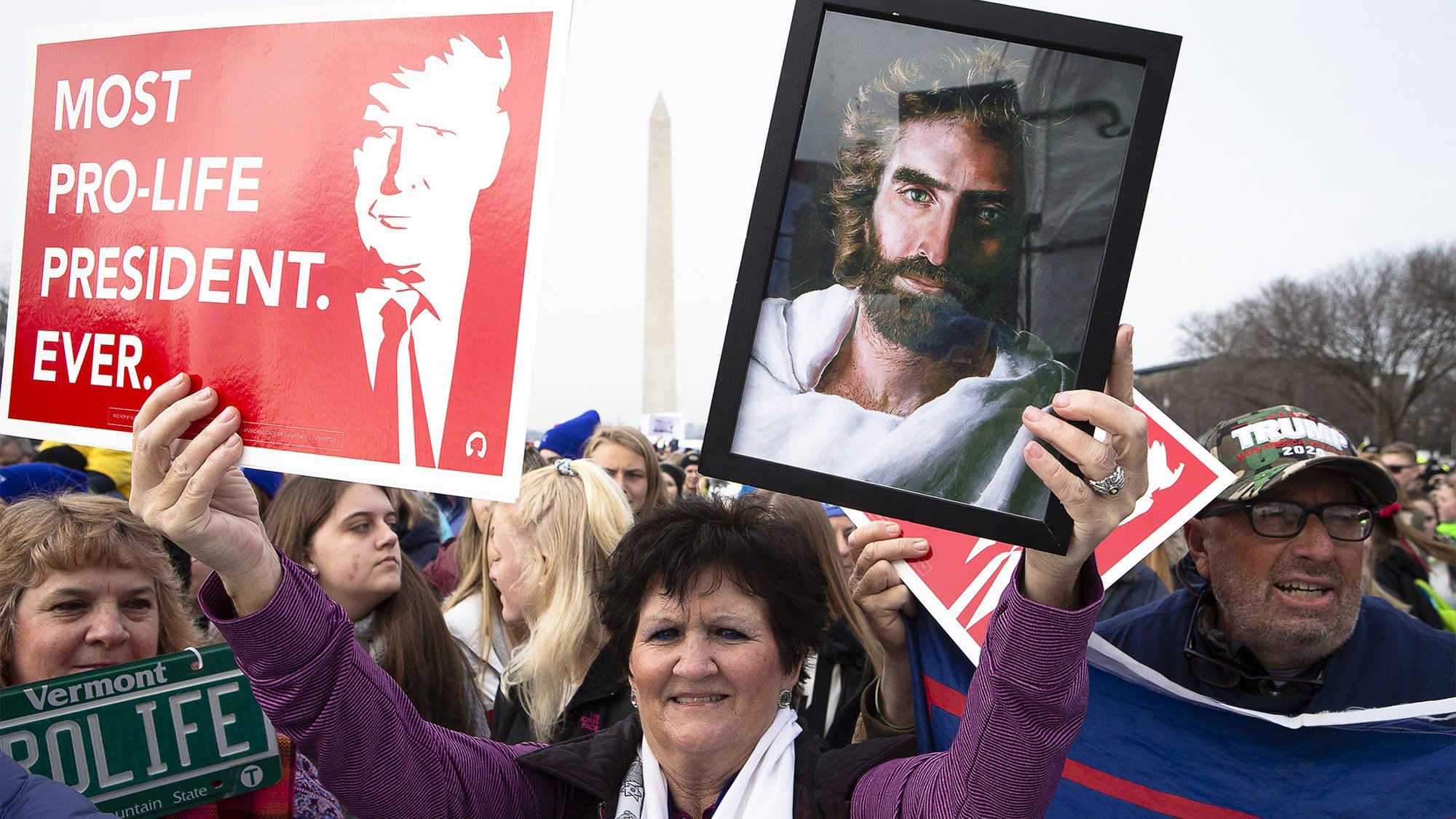 A woman holds an image of Jesus alongside the likeness of President Donald J. Trump during the annual March for Life rally in Washington Jan. 24, 2020. (CNS photo/Tyler Orsburn)