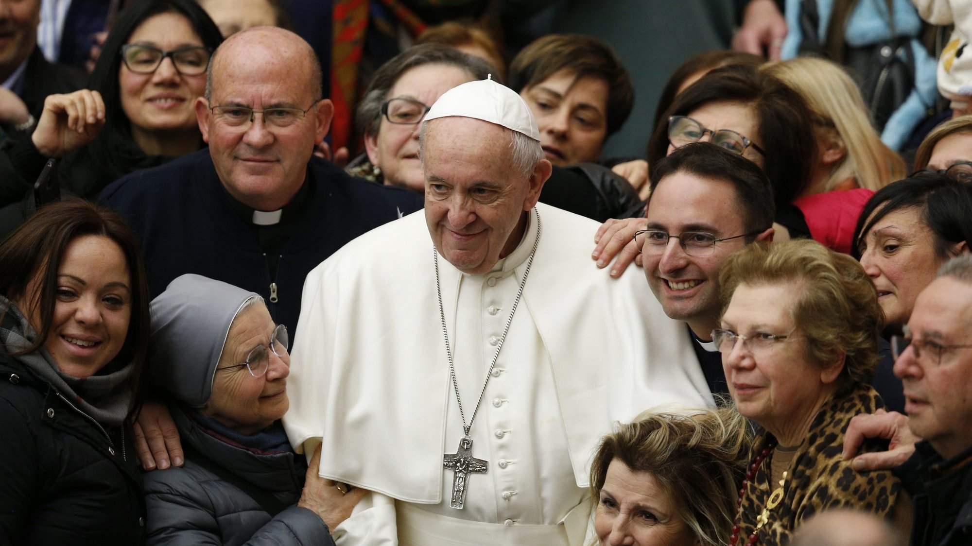 Pope Francis poses with people during his general audience in Paul VI hall at the Vatican Jan. 29, 2020. (CNS photo/Paul Haring)