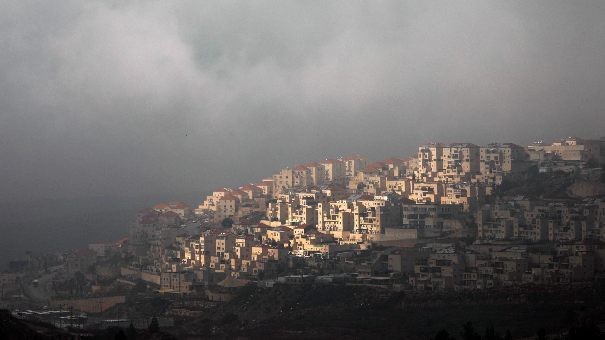 Clouds frame a section of the Israeli settlement of Beitar Illit in the Israeli-occupied West Bank Jan. 29, 2020. (CNS photo/Amir Cohen, Reuters)