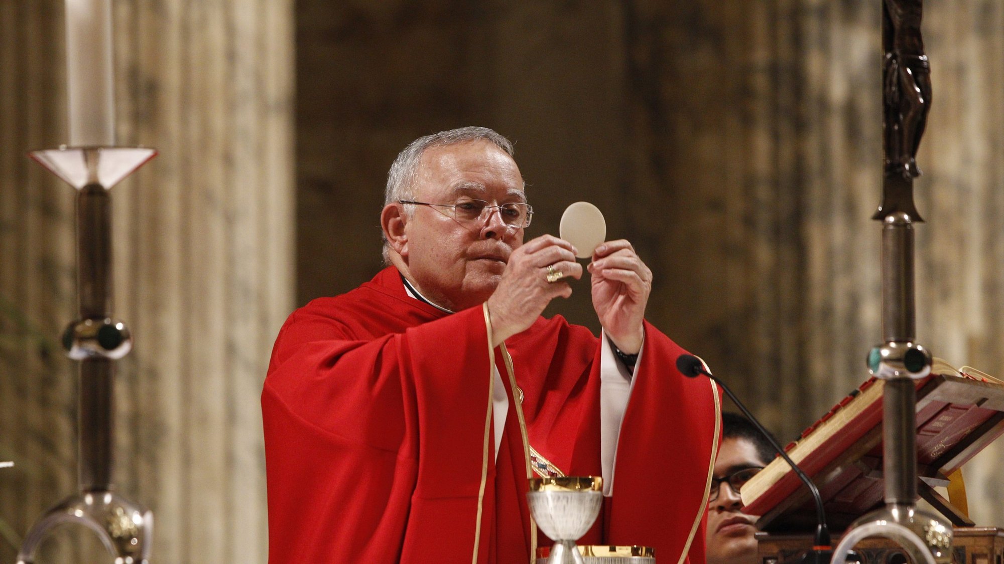 Archbishop Charles J. Chaput of Philadelphia elevates the Eucharist as U.S. bishops from New Jersey and Pennsylvania concelebrate Mass at the Basilica of St. Paul Outside the Walls in Rome Nov. 27, 2019. (CNS photo/Robert Duncan)