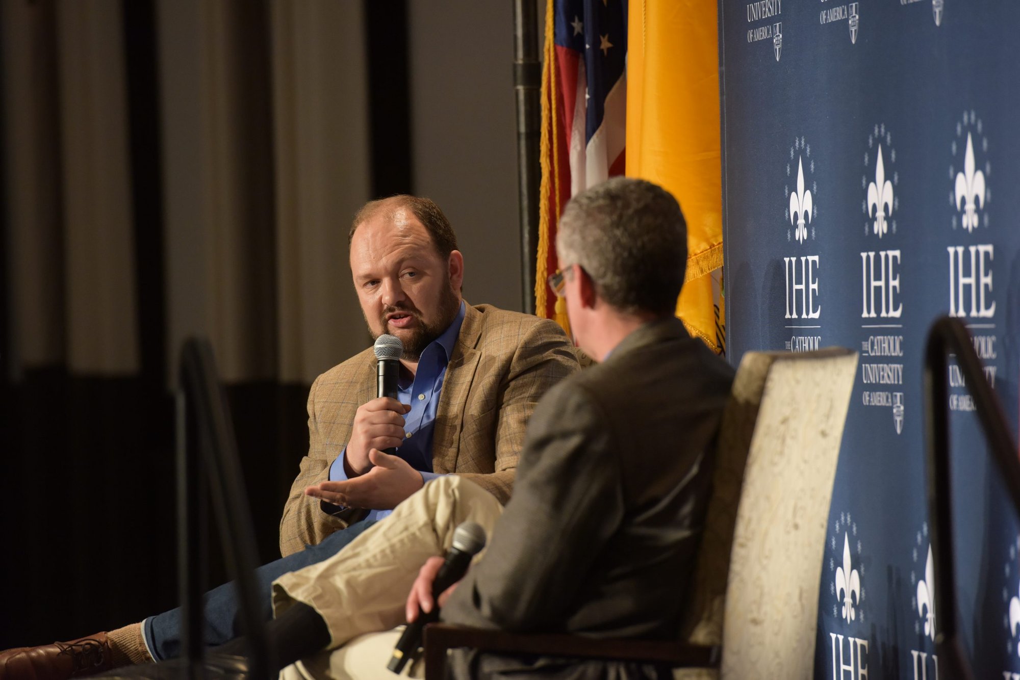 Ross Douthat discussed his book "The Decadent Society" with Dr. Joseph Capizzi, the executive director of The Institute of Human Ecology, at the Catholic University of America in Washington, D.C., Feb. 25. (Patrick Ryan/Catholic University of America)