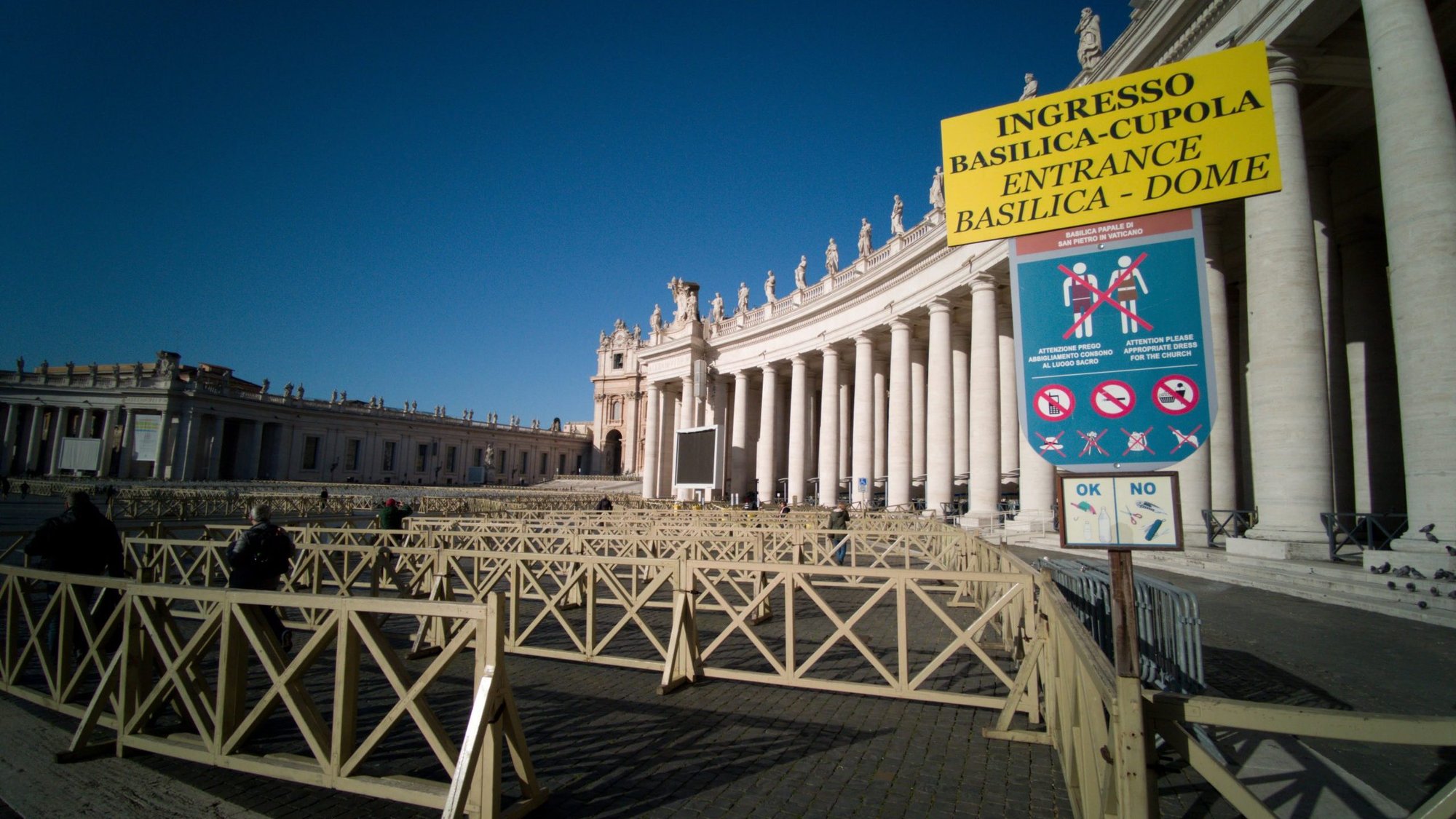 Several visitors enter an empty security queue before visiting St. Peter's Basilica at the Vatican March 4, 2020. Visitors and pilgrims to churches, museums and landmarks in Rome have sharply declined following an outbreak of the COVID-19 coronavirus in northern Italy. (CNS photo/Junno Arocho Esteves)