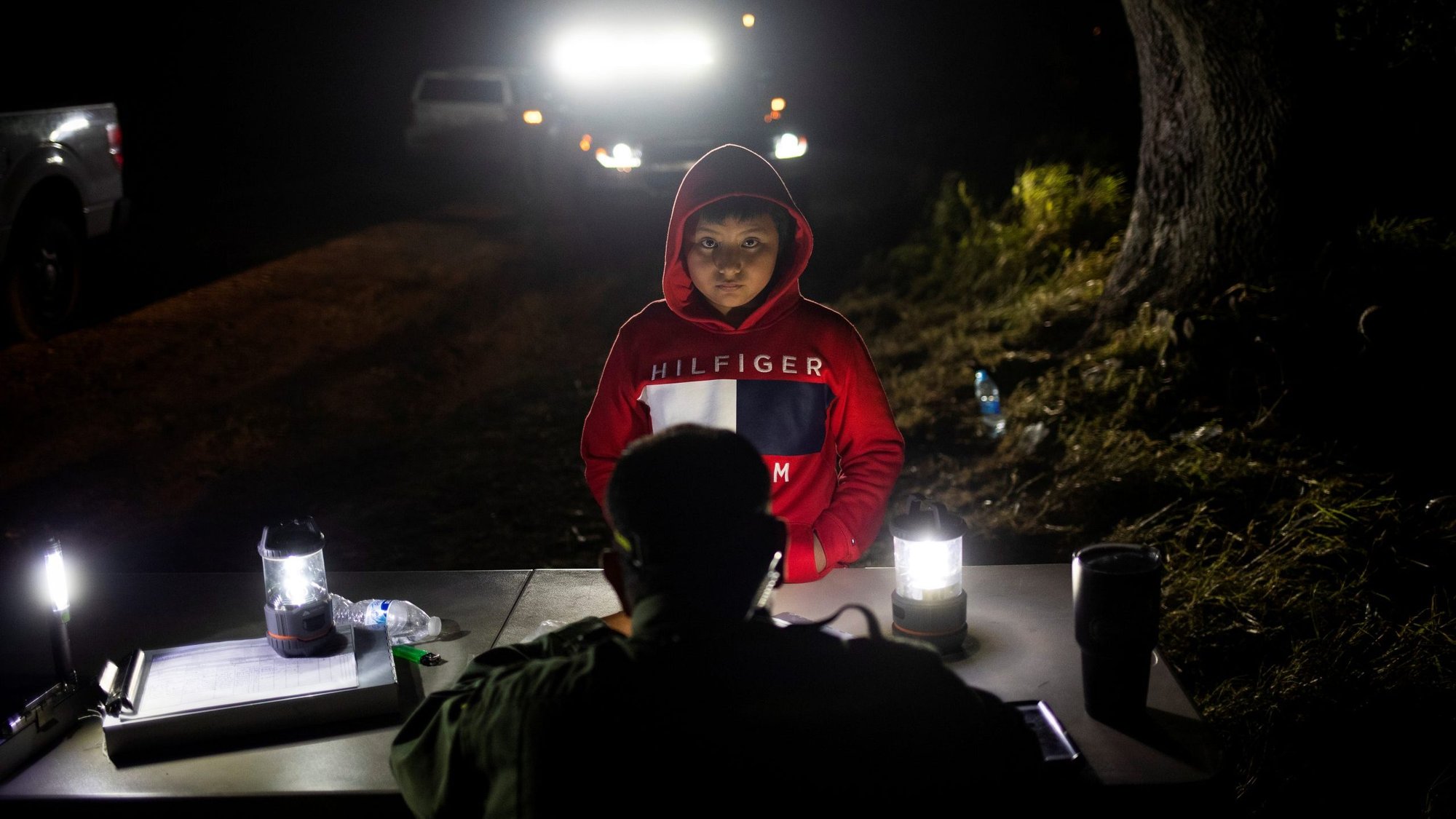 Juan, an 8-year-old unaccompanied minor from Guatemala who was traveling without any guardians, is registered by a Border Patrol agent in Los Ebanos, Texas, May 7, 2019. The U.S. Supreme Court ruled March 11 that President Donald Trump's "Remain in Mexico" policy for asylum-seekers can continue while suits against the protocols work their way through lower courts. (CNS photo/Adrees Latif, Reuters)