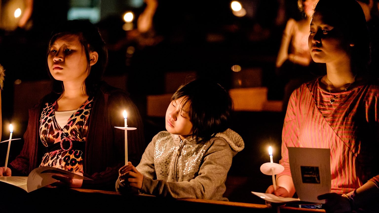 Young people hold candles during the Easter Vigil at the Cathedral of St. Joseph in Hartford, Conn., April 4, 2015. (CNS photo/Bob Mullen)