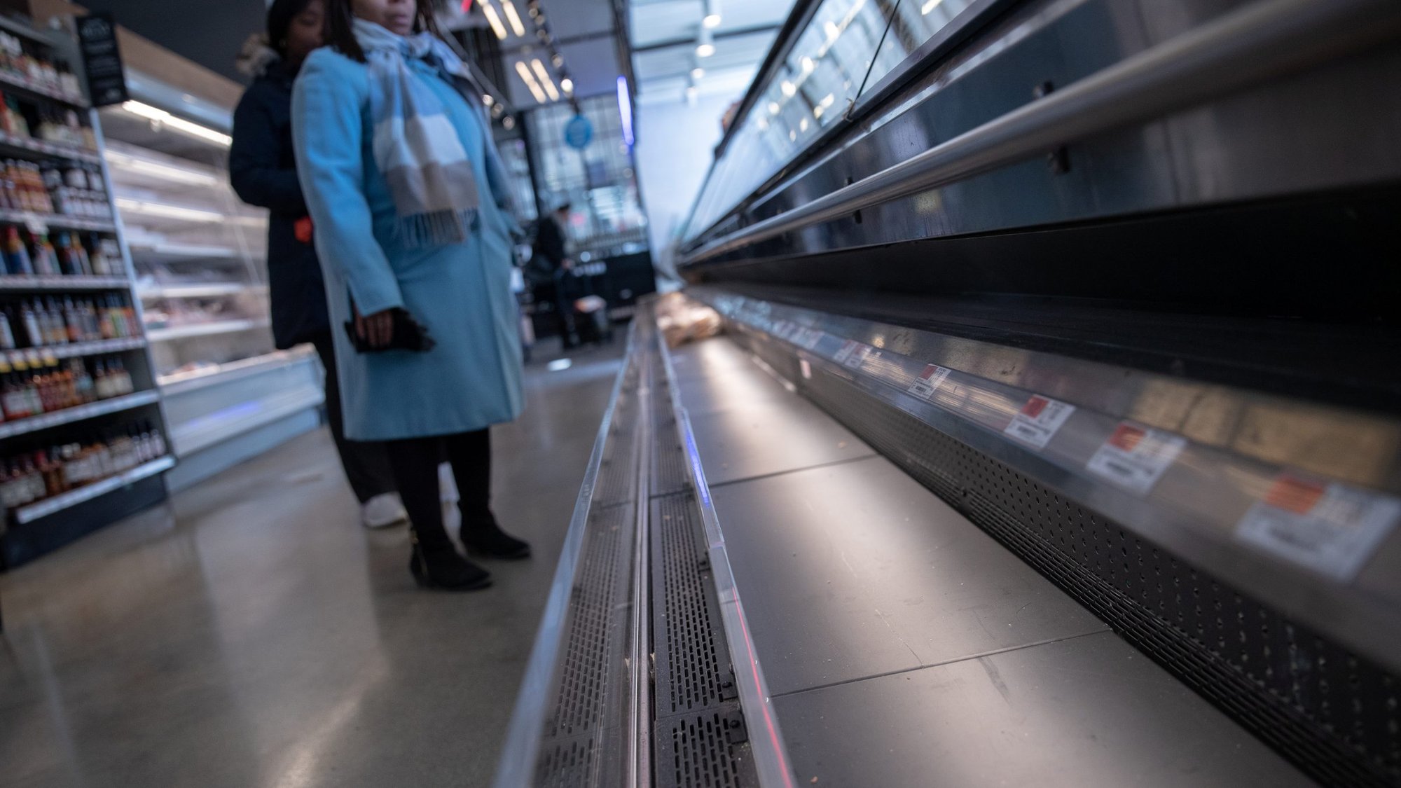 Empty shelves that usually contain meat products are seen in a New York City store March 16, 2020, following the outbreak of coronavirus. Bishop David A. Zubik of Pittsburgh is among U.S. bishops dispensing Catholics from the obligation to abstain from meat on Lenten Fridays with the exception of Good Friday. "As you are aware, many of the shelves and cases in our supermarkets are sparse if not empty. This is a time when pastoral necessity has informed my decision effective today," the bishop said. (CNS photo/Jeenah Moon, Reuters)