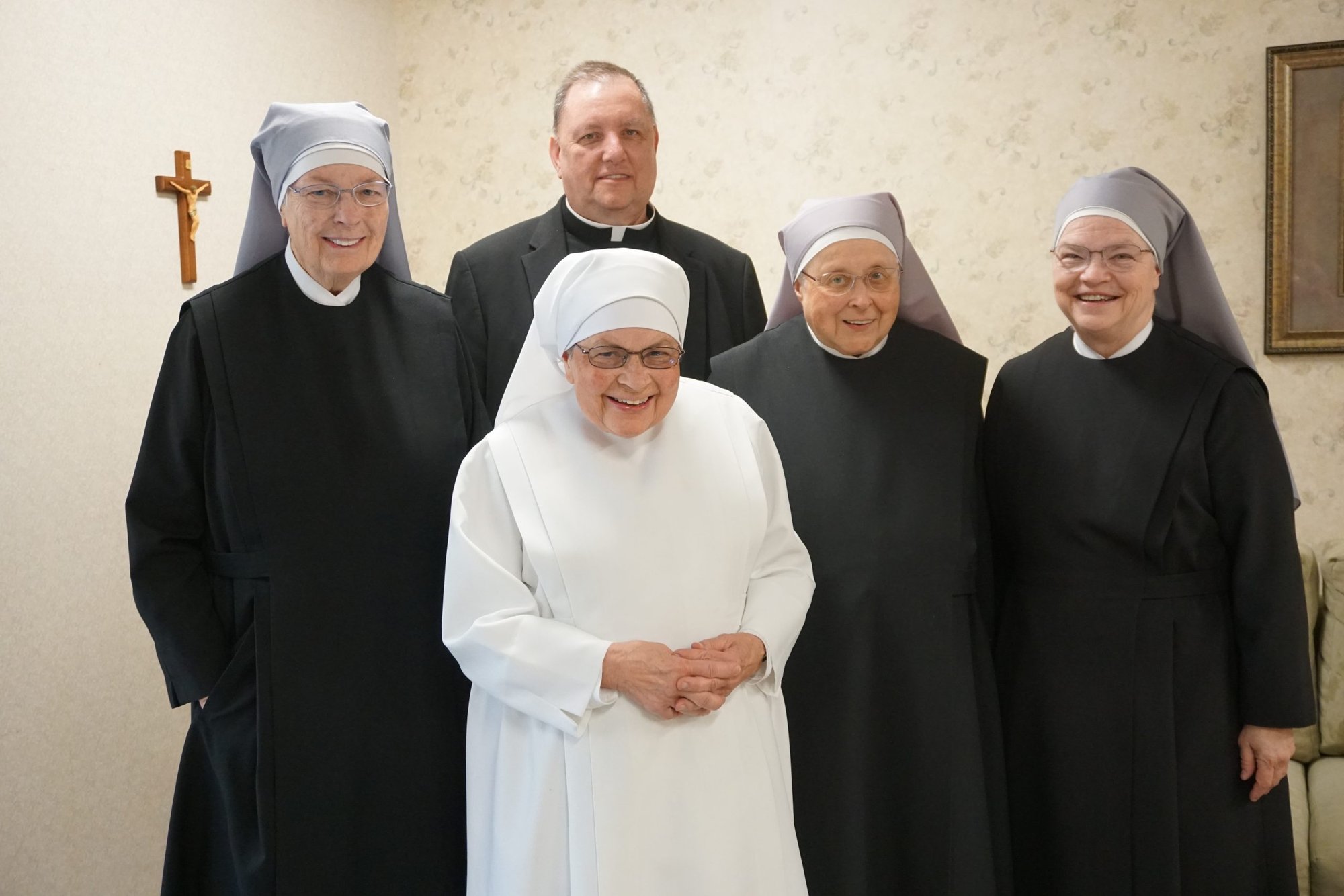 From left: Little Sisters of the Poor Mother Marguerite McCarthy, Sister Anthony Selewicz, Sister Clotilde Jardim, and Mother Maria Christine Lynch with Father Father Mark Cregan, CSC, the order's general counsel. (R.W. Dellinger)