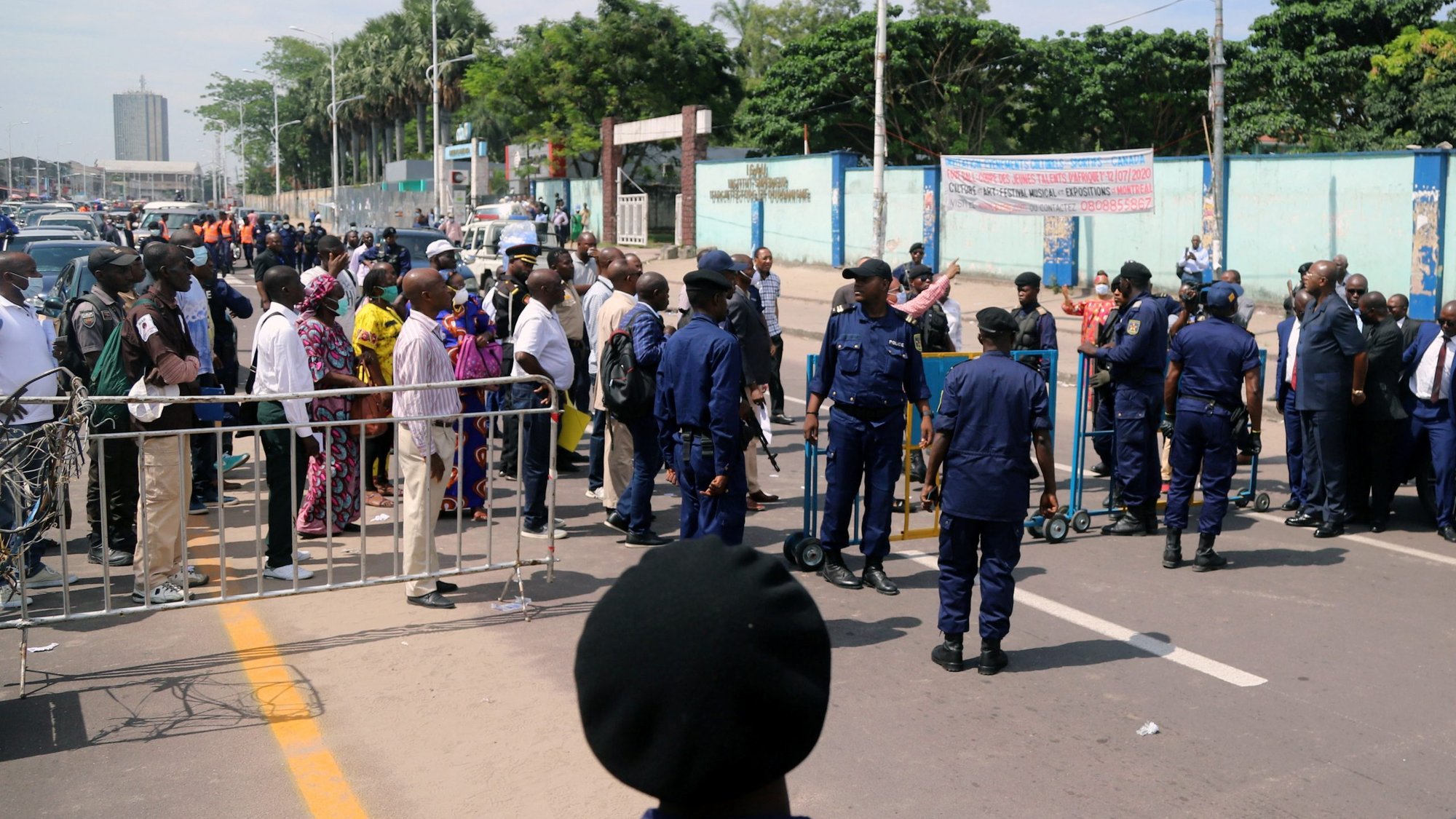 Congolese police officers control civilians during a total lockdown in Kinshasa March 28, 2020, during the COVID-19 pandemic. (CNS photo/Kenny Katombe, Reuters)