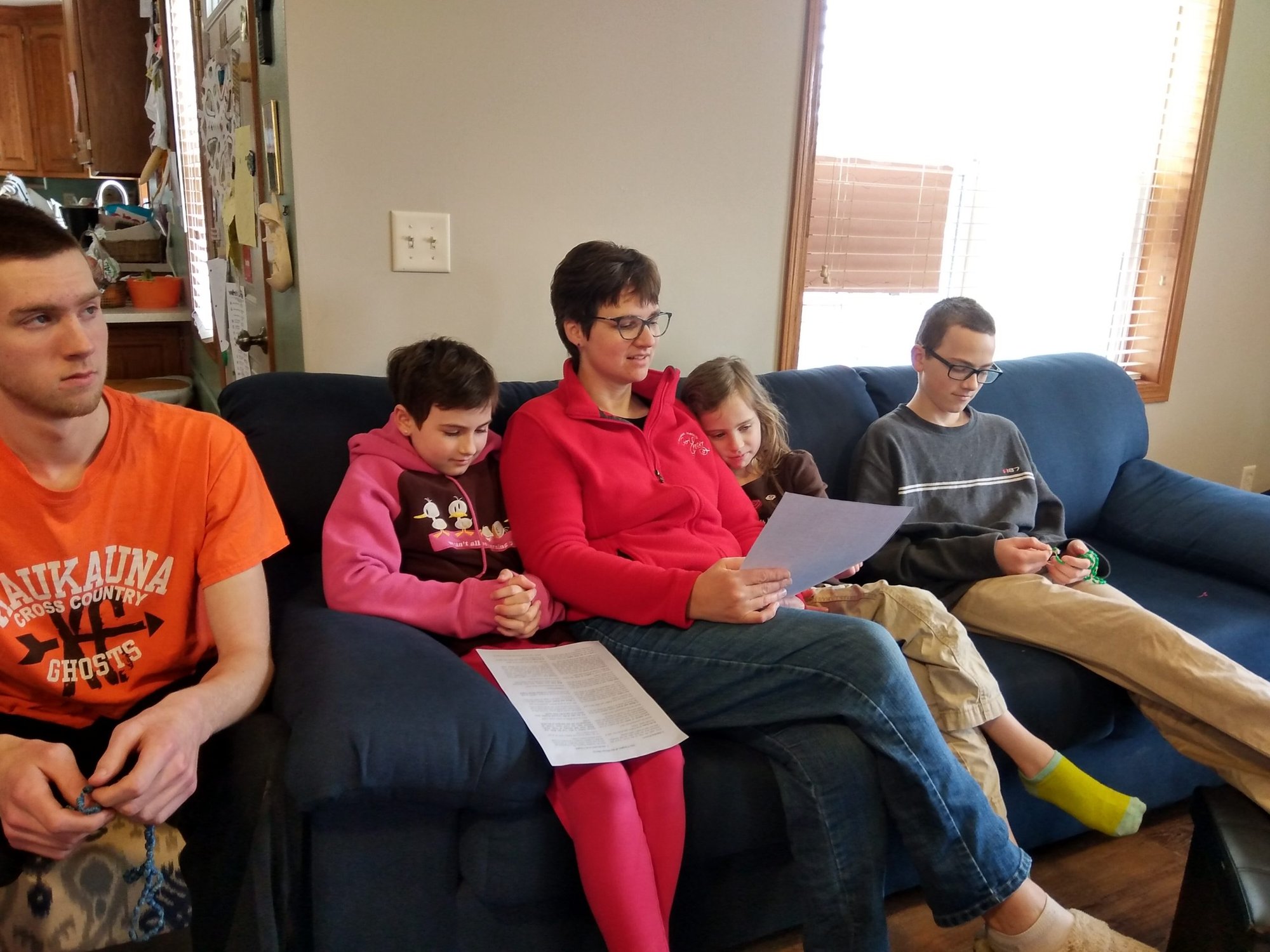 Nancy Vande Hey (center) and some of her children gather in the family room to pray the Divine Mercy Chaplet. (Courtesy of the Vande Hey family)