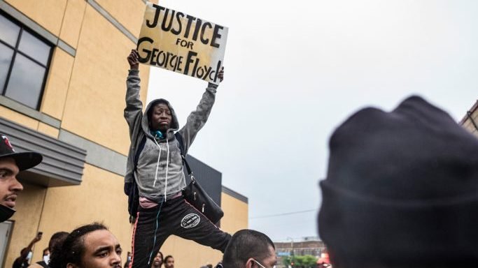 Protesters gather near the Minnesota Police 3rd Precinct during a gathering Tuesday, May 26, 2020, in response to the death the day before of George Floyd in police custody. Four Minneapolis officers involved in the arrest of Floyd, a black man who died in police custody, were fired Tuesday, hours after a bystander’s video showed an officer kneeling on the handcuffed man’s neck, even after he pleaded that he could not breathe and stopped moving. (Richard Tsong-Taatarii/Star Tribune/AP via Crux)