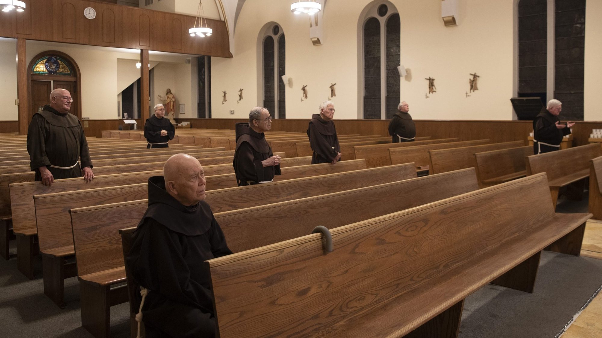 Franciscan friars pray at St. Anthony of Padua Church in Butler, N.J., April 11, 2020. The U.S. Supreme Court rejected appeals to lift restrictions limiting congregation sizes May 29 during the coronavirus pandemic. (CNS photo/Octavio Duran)