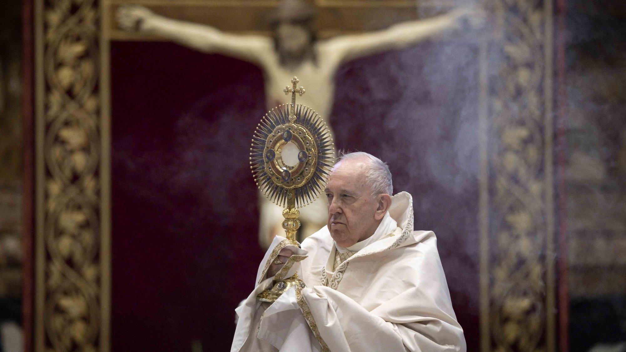 Pope Francis leads Benediction as he celebrates Mass marking the feast of Corpus Christi in St. Peter's Basilica at the Vatican June 14, 2020. The Mass was celebrated with a small congregation of some 50 people as part of efforts to contain spread of the coronavirus. (CNS photo/Vatican Media)