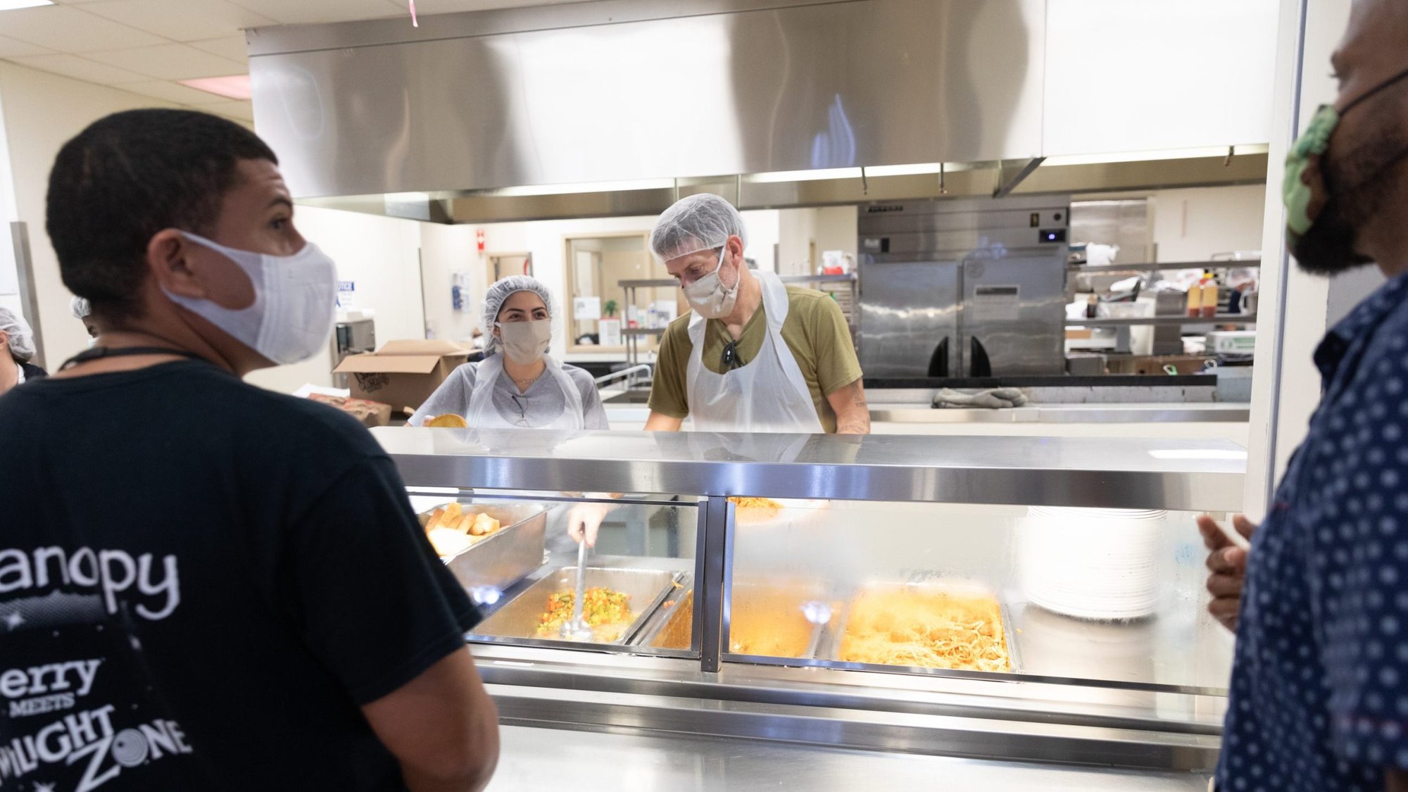 Resident guests at Camillus House in downtown Miami maintain social distance in the cafeteria April 30, 2020, during the coronavirus pandemic. (CNS photo/Tom Tracy)