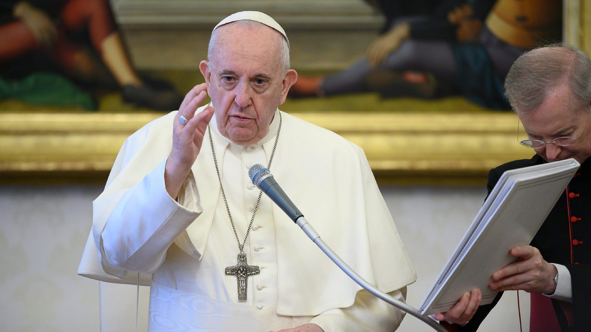 Pope Francis delivers his blessing as he leads his general audience in the library of the Apostolic Palace at the Vatican June 17, 2020. During the audience, the pope said that true believers do not condemn people for their sins or shortcomings but intercede on their behalf with God through prayer. (CNS photo/Vatican Media)