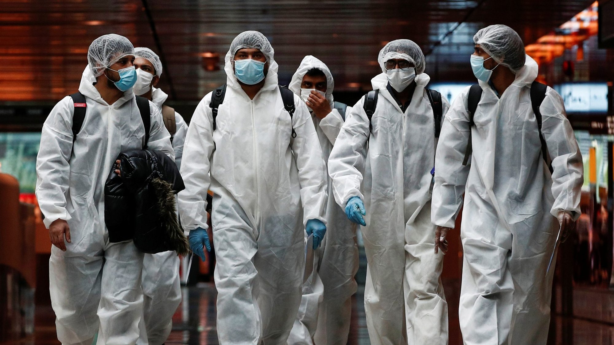 Seafarers who have spent months working onboard vessels during the COVID-19 pandemic arrive June 12, 2020, at Changi Airport in Singapore. (CNS photo/Edgar Su, Reuters)