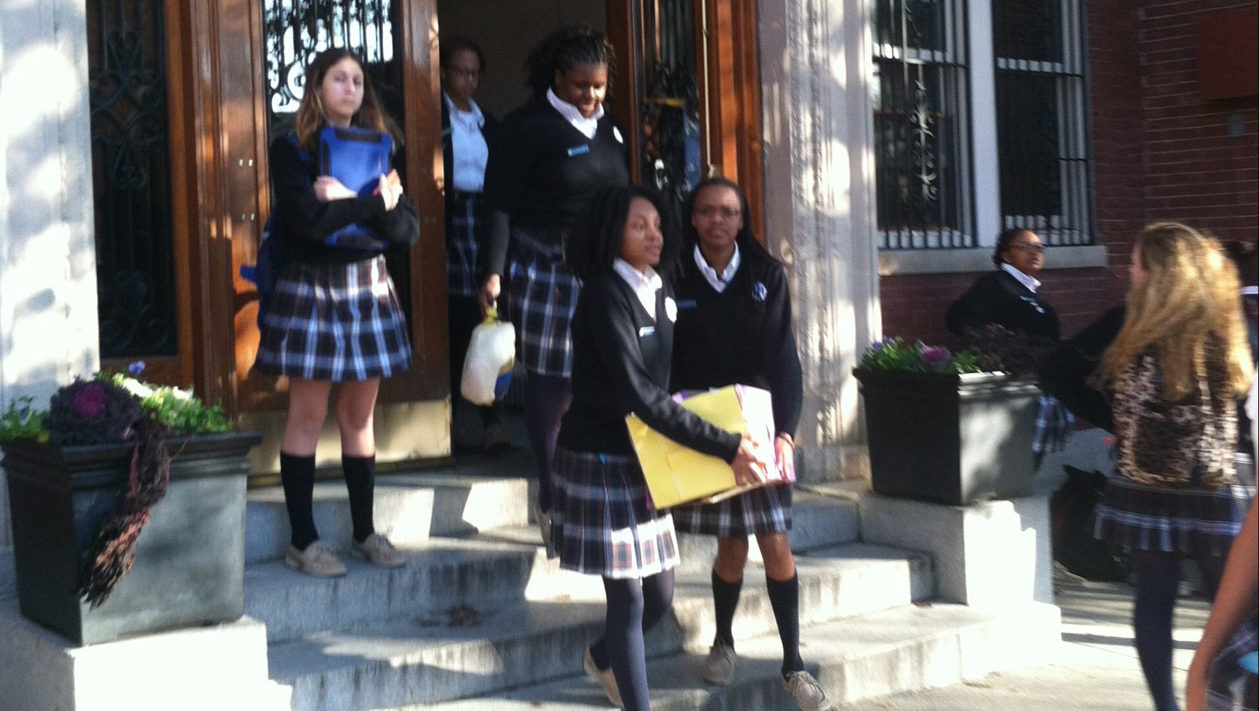 Students walk out of the Institute of Notre Dame building in Baltimore, in this 2014 photo. The Catholic school, which began educating girls in 1847 with alumni that include House Speaker Nancy Pelosi, closed its doors for good at the end of the 2019-2020 school year. (CNS photo/courtesy Institute of Notre Dame)