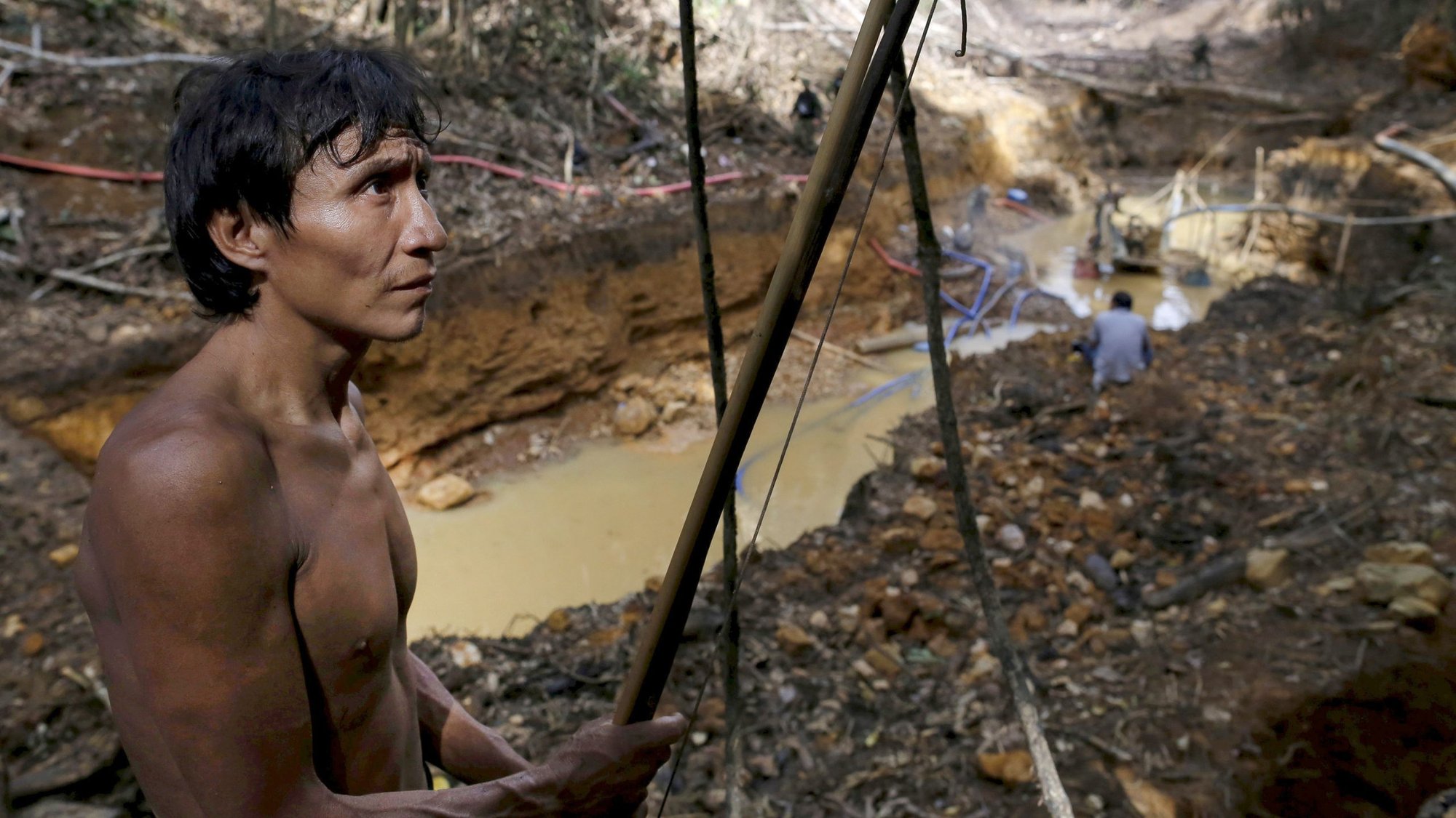 A file photo shows a Yanomami standing near an illegal gold mine on indigenous land in the heart of Brazil's Amazon rainforest. (CNS photo/Bruno Kelly, Reuters)