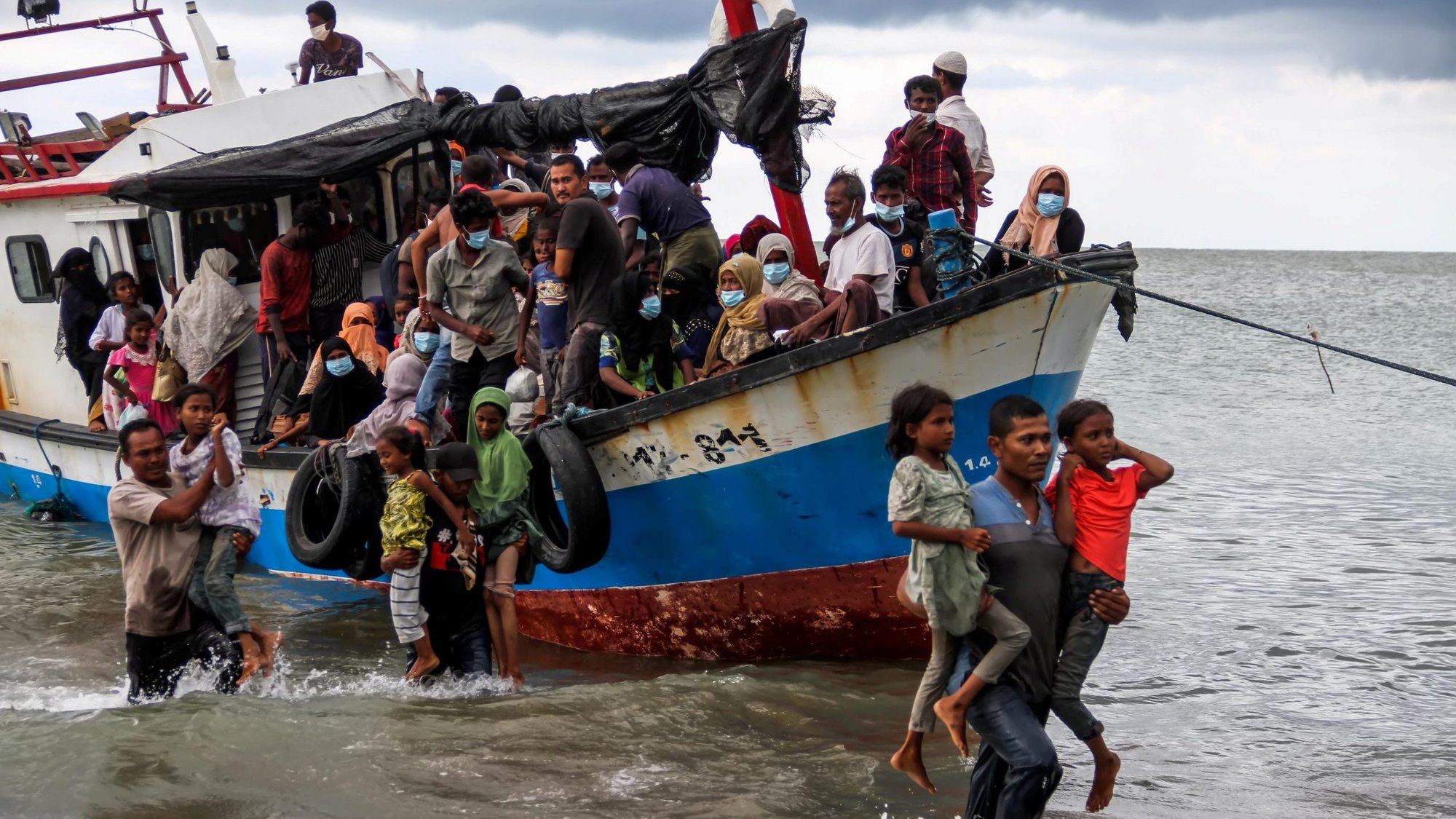 Rohingya refugees are evacuated from a boat by locals near the coast of Seunuddon beach in Aceh, Indonesia, June 25, 2020. (CNS photo/Antara Foto, Rahmad via Reuters)