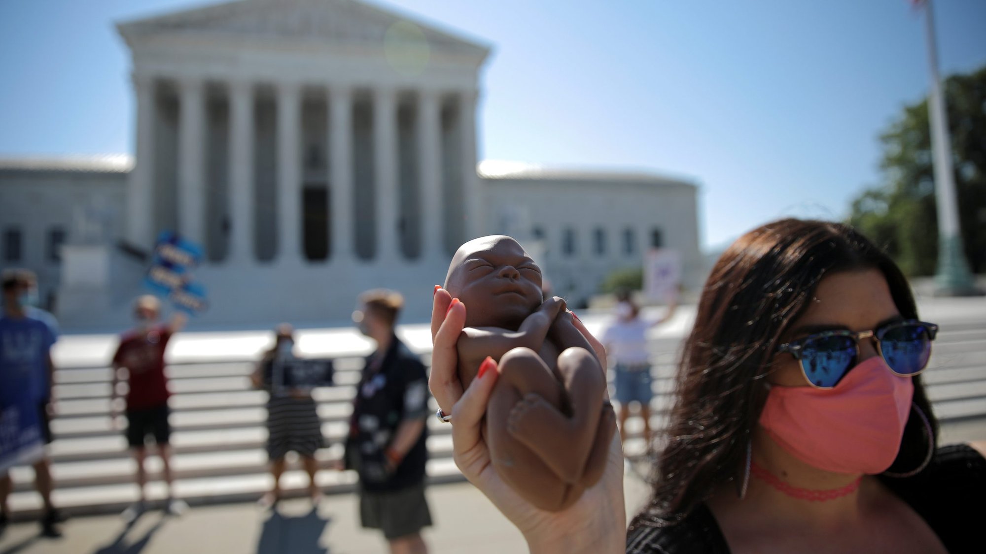 Pro-life activists gather outside the U.S. Supreme Court in Washington June 29, 2020. (CNS photo/Carlos Barria, Reuters)