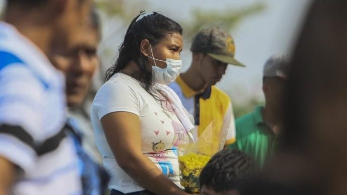 A woman wears a mask against the spread of COVID-19 disease, as she attends a funeral at the Central cemetery of Managua, Nicaragua, Monday, May 11, 2020. (Alfredo Zuniga/AP via Crux)