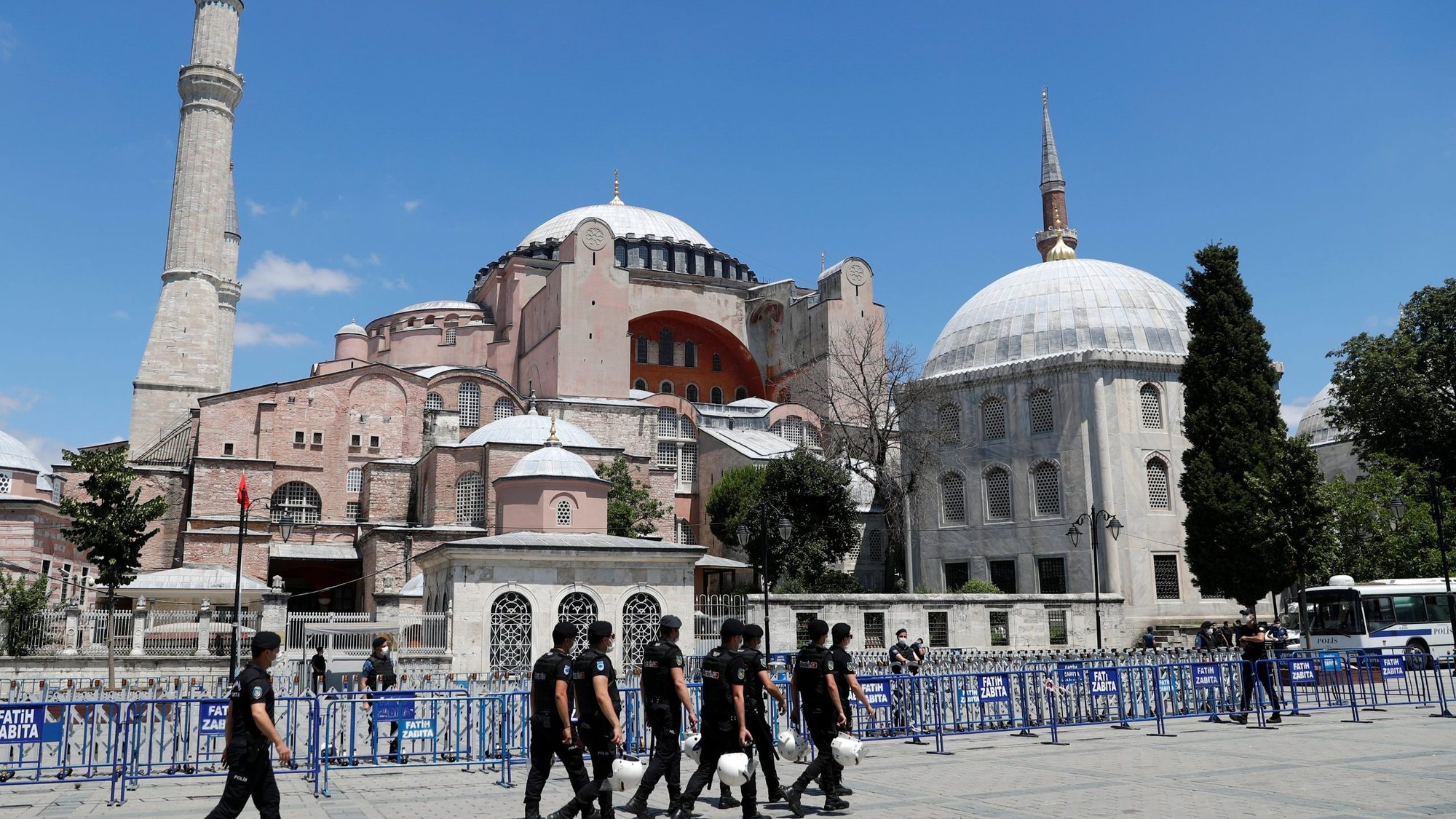 Turkish police officers walk in front of Hagia Sophia in Istanbul July 11, 2020. (CNS photo/Murad Sezer, Reuters)