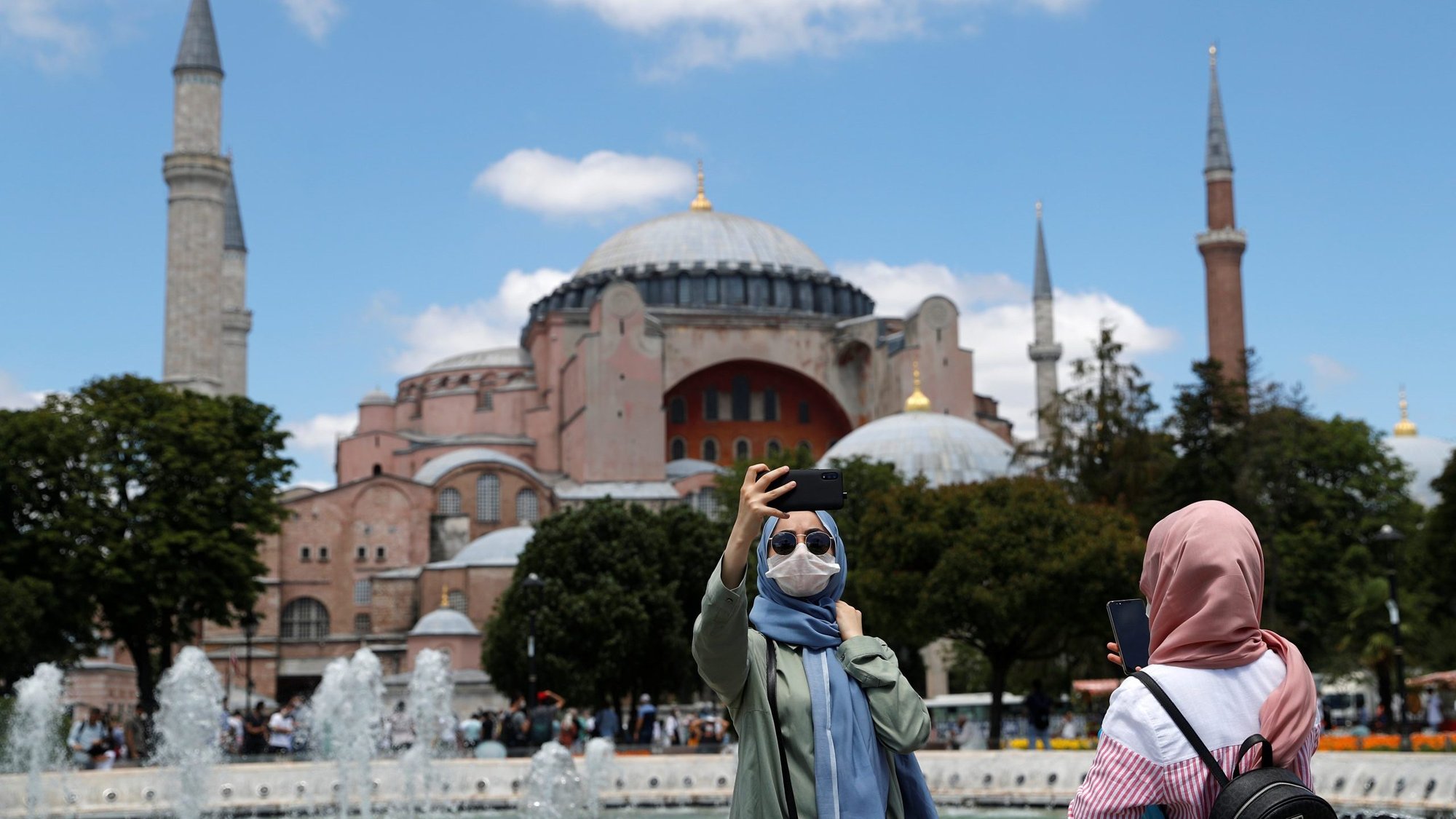A woman poses for a selfie in front of Hagia Sophia in Istanbul July 11, 2020. (CNS photo/Murad Sezer, Reuters)