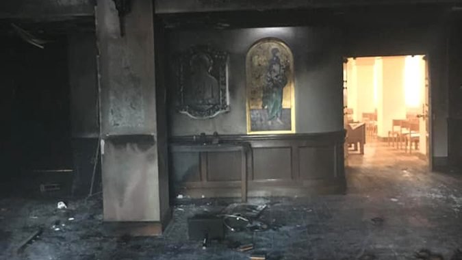 Queen of Peace Catholic Church in Ocala, Fla., is seen July 13, 2020, after it was set ablaze by a suspect who drove his van through the front doors two days earlier. (CNS photo/courtesy The Florida Catholic)