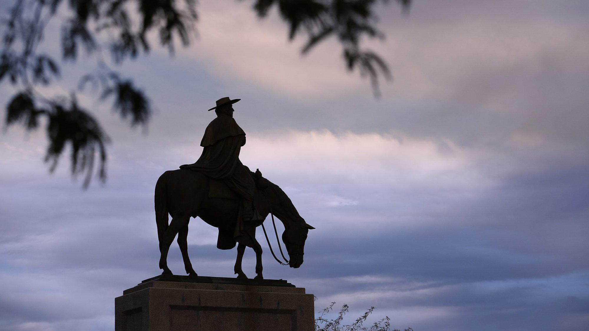 In this 2017 file photo, an equine statue of Jesuit Father Eusebio Kino sits along Kino Parkway in Tucson, Ariz. On July 13, 2020, Pope Francis recognized Father Kino's heroic virtues, giving him the title "venerable" and advancing his sainthood cause. (CNS photo/Nancy Wiechec)