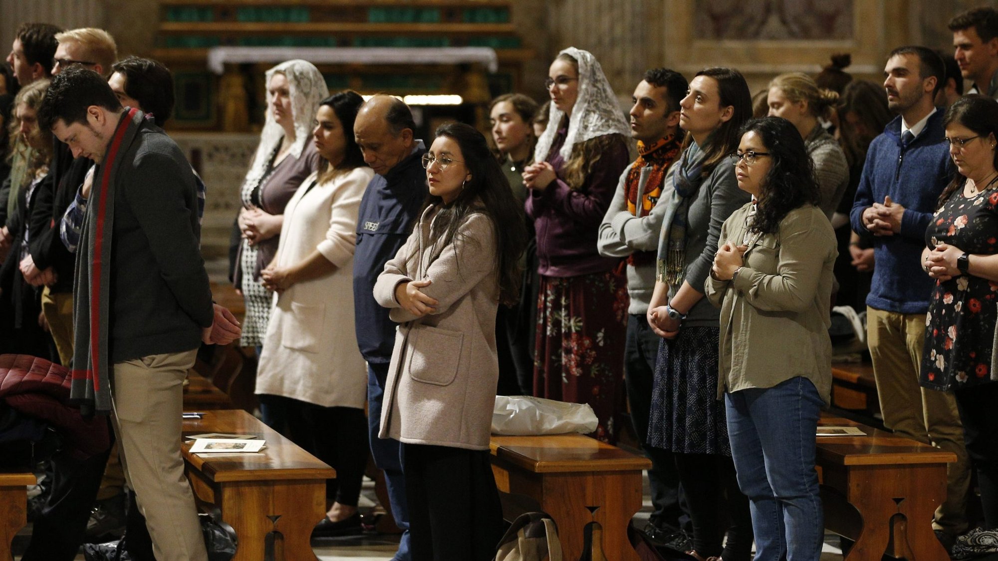 Young adults from the Archdiocese of St. Paul and Minneapolis, the Diocese of New Ulm, Minn., and the Diocese of Bismarck, N.D., attend Mass with U.S. bishops at the Basilica of St. Paul Outside the Walls in Rome Jan. 15, 2020. The U.S. Catholic Church will convene a yearlong intercultural process with young adults and ministry leaders July 25. (CNS photo/Paul Haring)