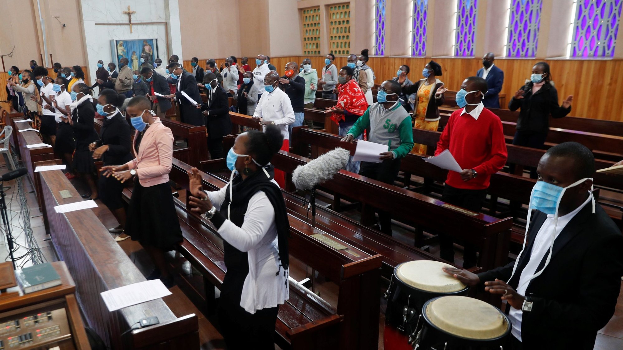 People wearing face masks attend a July 19, 2020, Mass at the Cathedral Basilica of the Holy Family in Nairobi, Kenya, on the first day the government allowed churches to reopen for worship during the coronavirus pandemic. A Vatican document underlines how parishes are not "businesses" that can be led by anyone, according to Cardinal Beniamino Stella, prefect of the Congregation for Clergy. (CNS photo/Thomas Mukoya, Reuters)