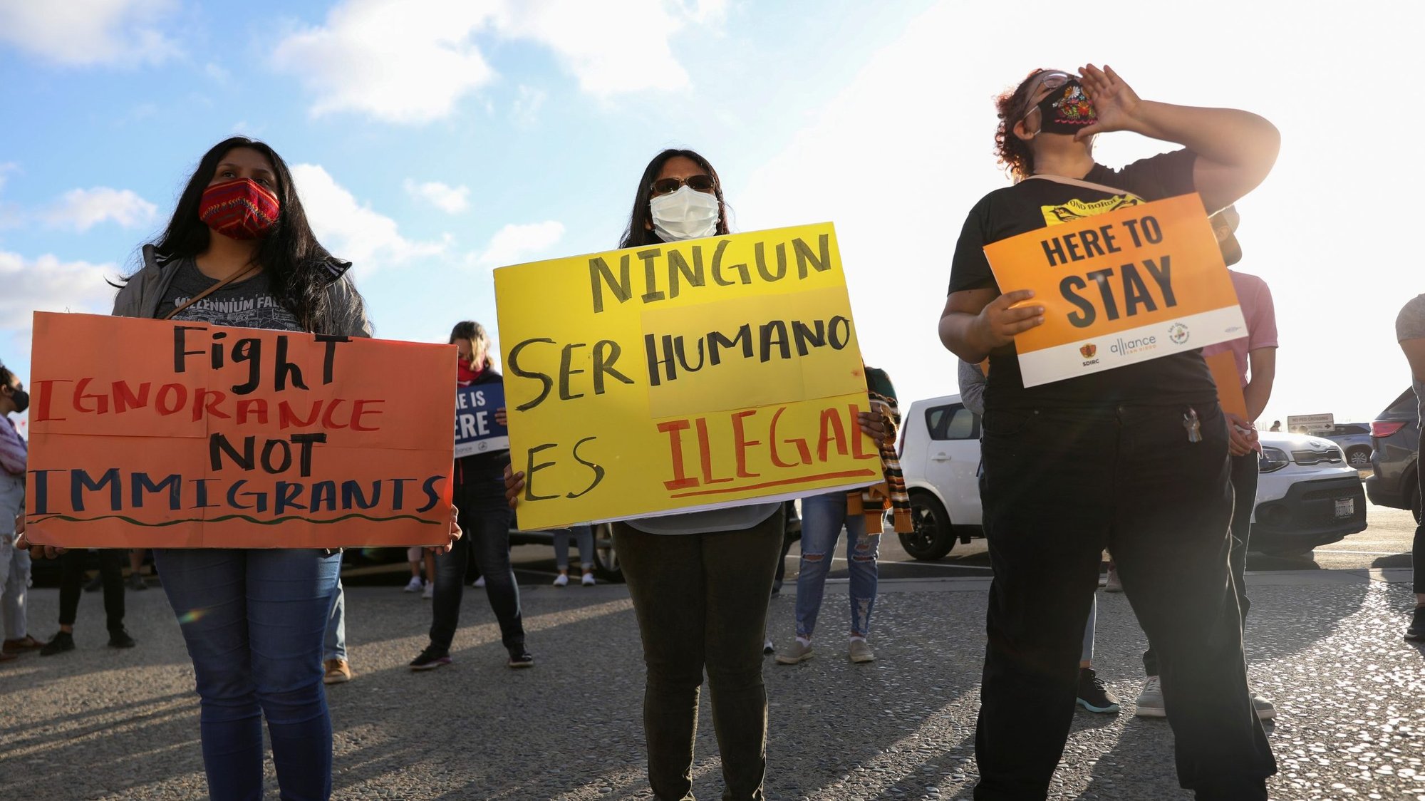People in San Diego hold signs supporting the Deferred Action for Childhood Arrivals program June 18, 2020. (CNS photo/Mike Blake, Reuters)