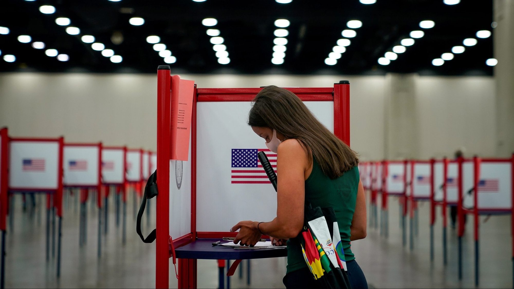 A young voter in Louisville, Ky., casts her ballot during the Kentucky primary election June 23, 2020, during the coronavirus pandemic. (CNS photo/Bryan Woolston, Reuters)