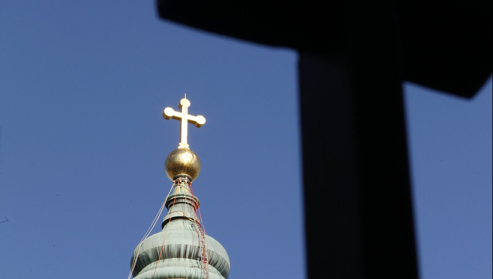 The gold cross and cupola of Philadelphia's Cathedral Basilica of Sts. Peter and Paul are pictured in this 2011 file photo. The Archdiocese of Philadelphia has so far paid $50 million to abuse survivors. (CNS photo/Nancy Wiechec)