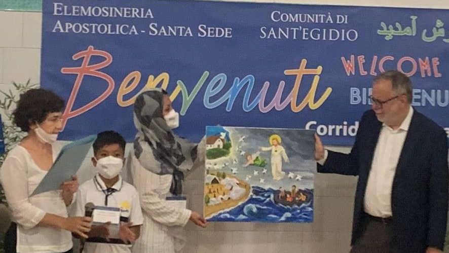 Refugees are welcomed to Rome by Andrea Riccardi, founder of the Community of Sant'Egidio. (Courtney Mares/CNA)